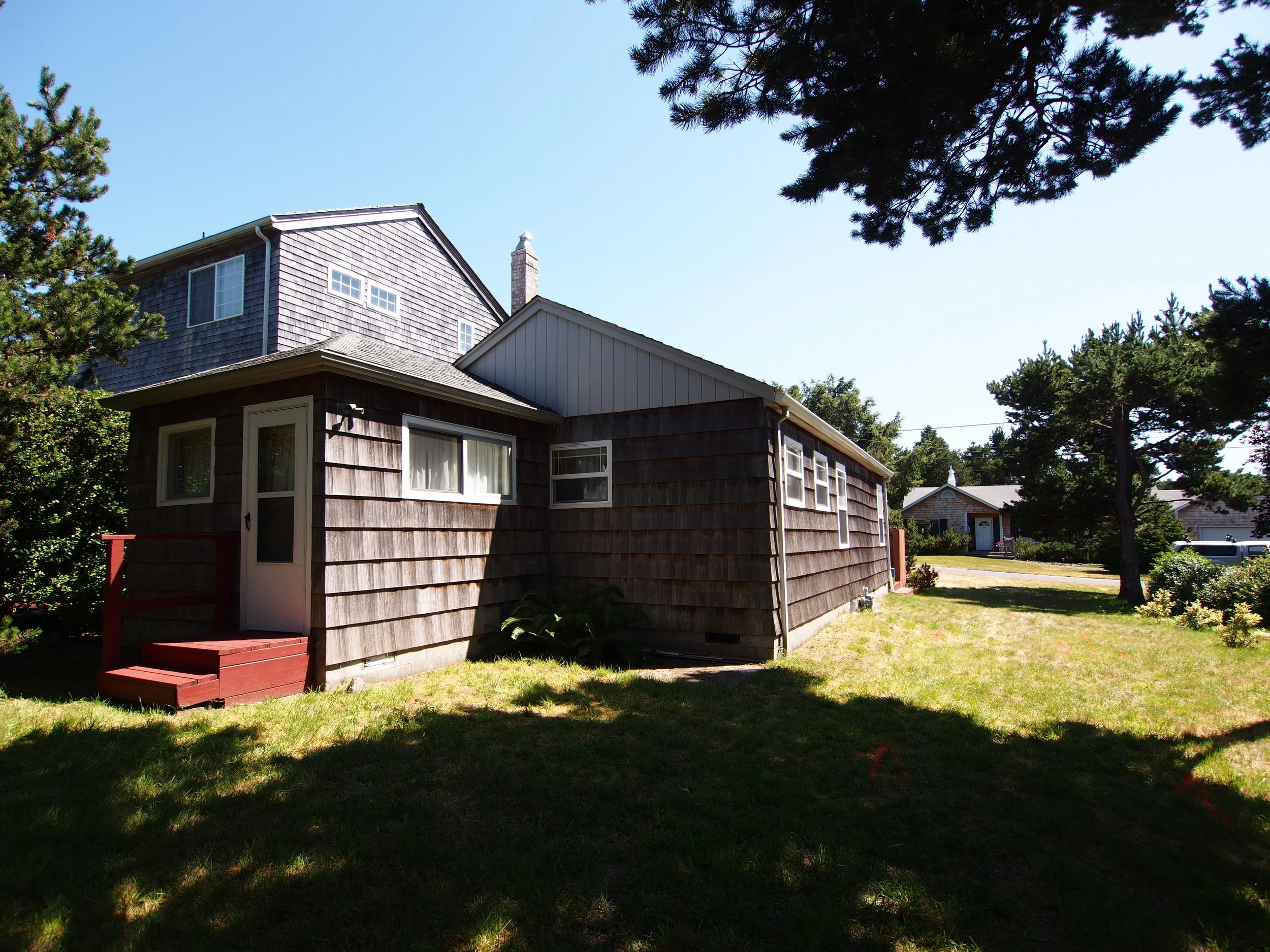 From the back. Pretty much everything under the tree's shadow is occupied by the house's sand-filter septic system -- and can't be built on.