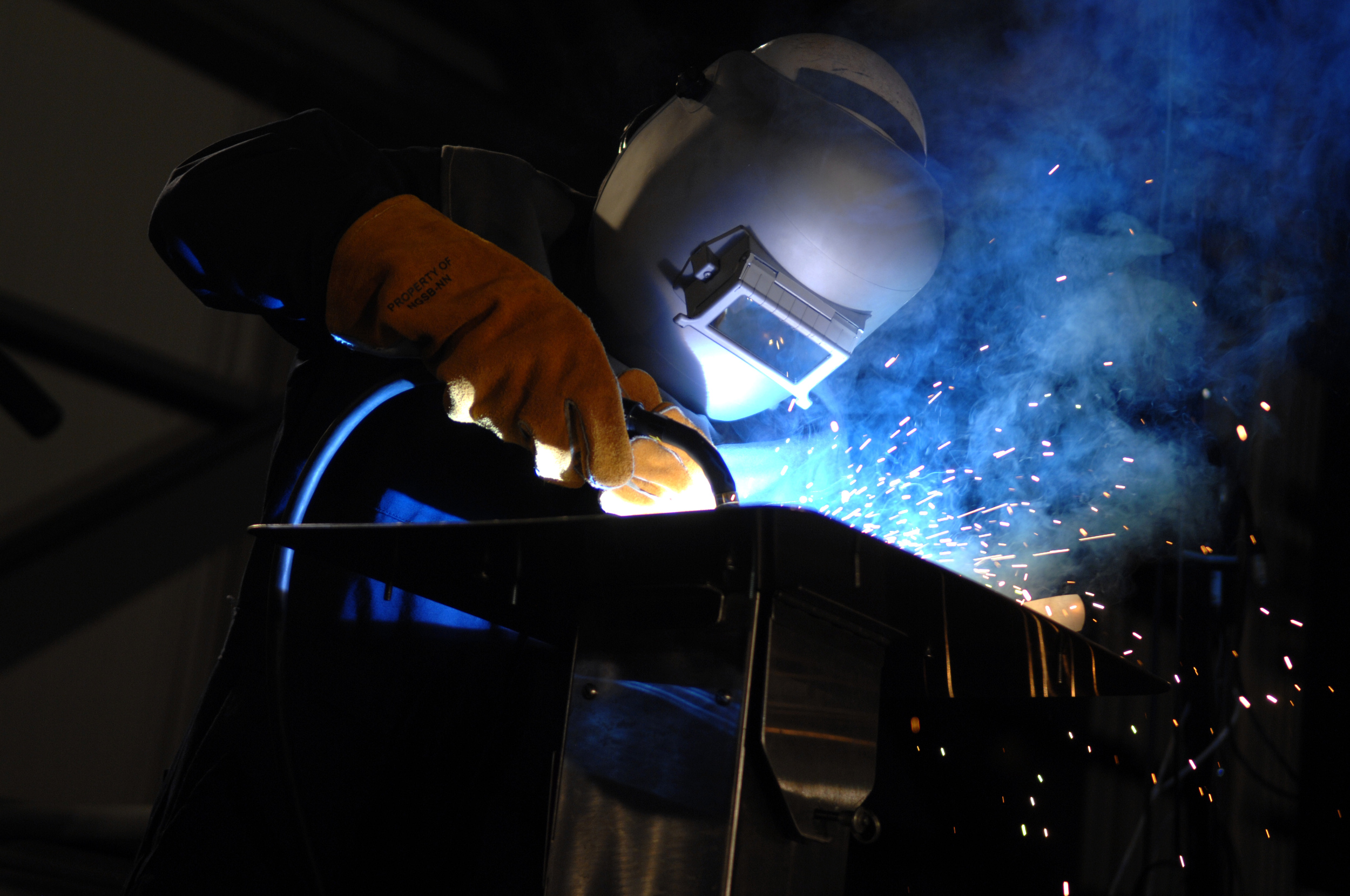 US_Navy_091114-N-5549O-135_Robert_Bowker_welds_the_initials_of_Susan_Ford_Bales_into_the_keel_of_the_aircraft_carrier_Gerald_R._Ford_(CVN_78)_during_a_keel_laying_and_authentication_ceremony.jpg