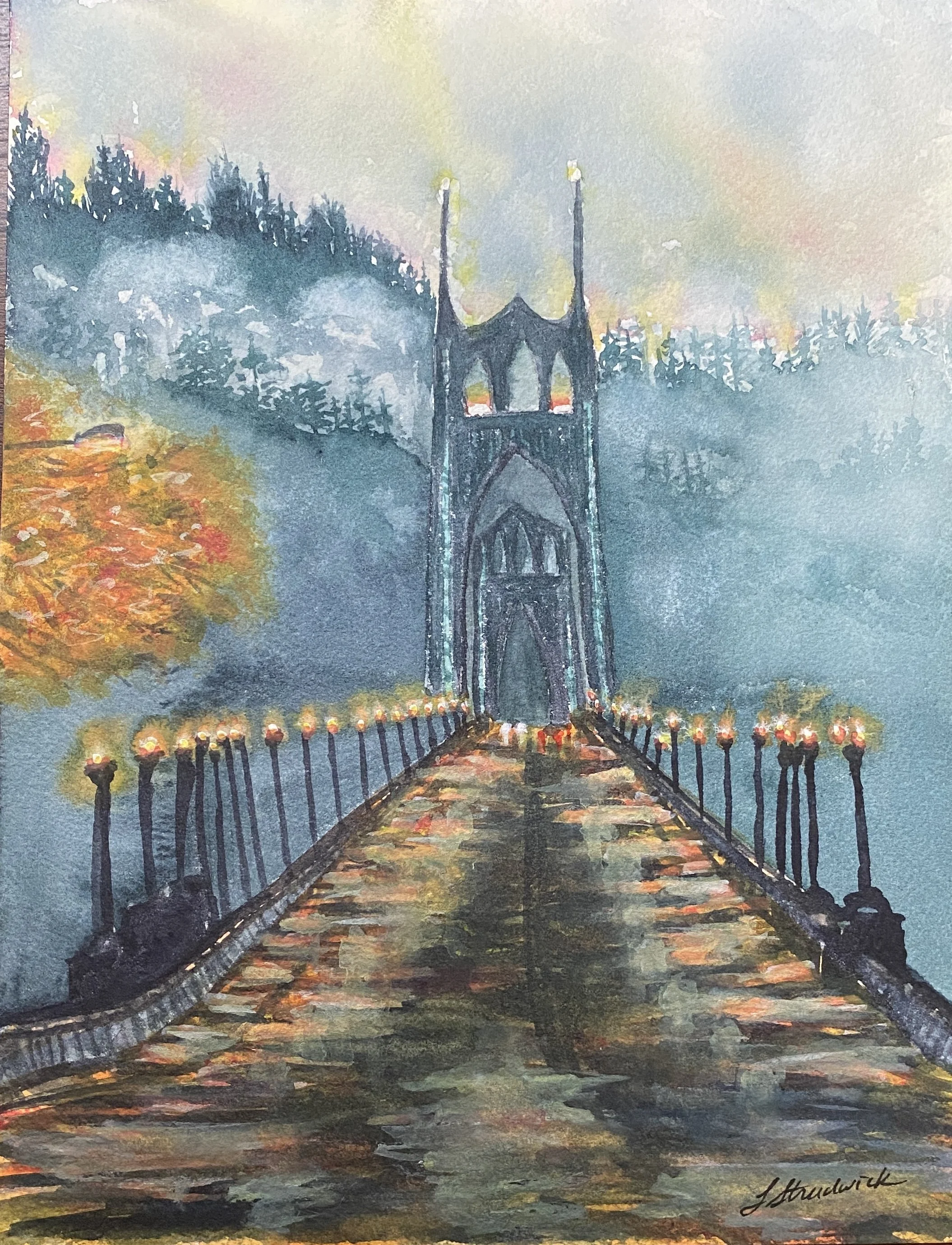 St. John's Bridge in Portland, OR on rainy evening with forested hills and clouds