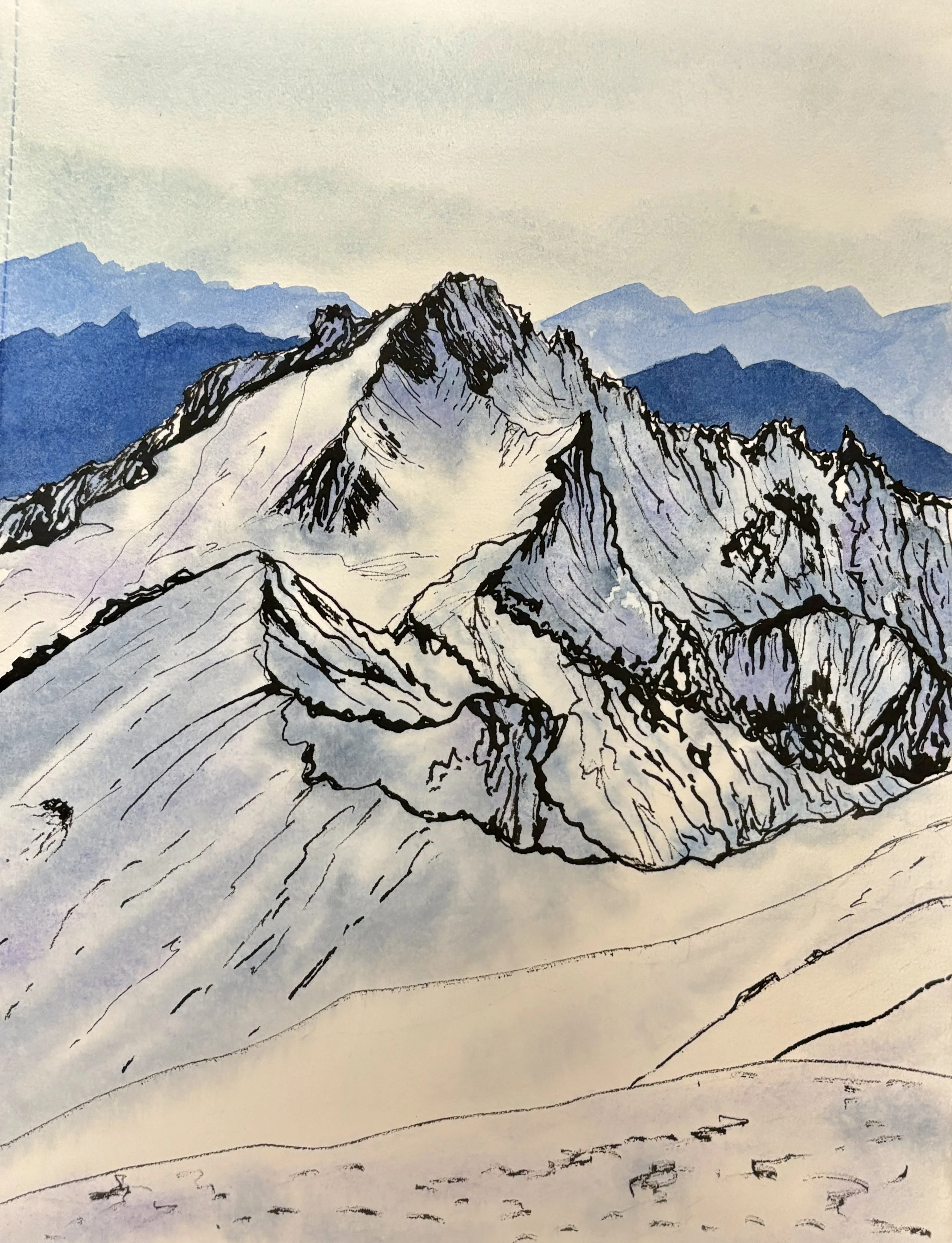 Snowy mountain top with ridges and shadows