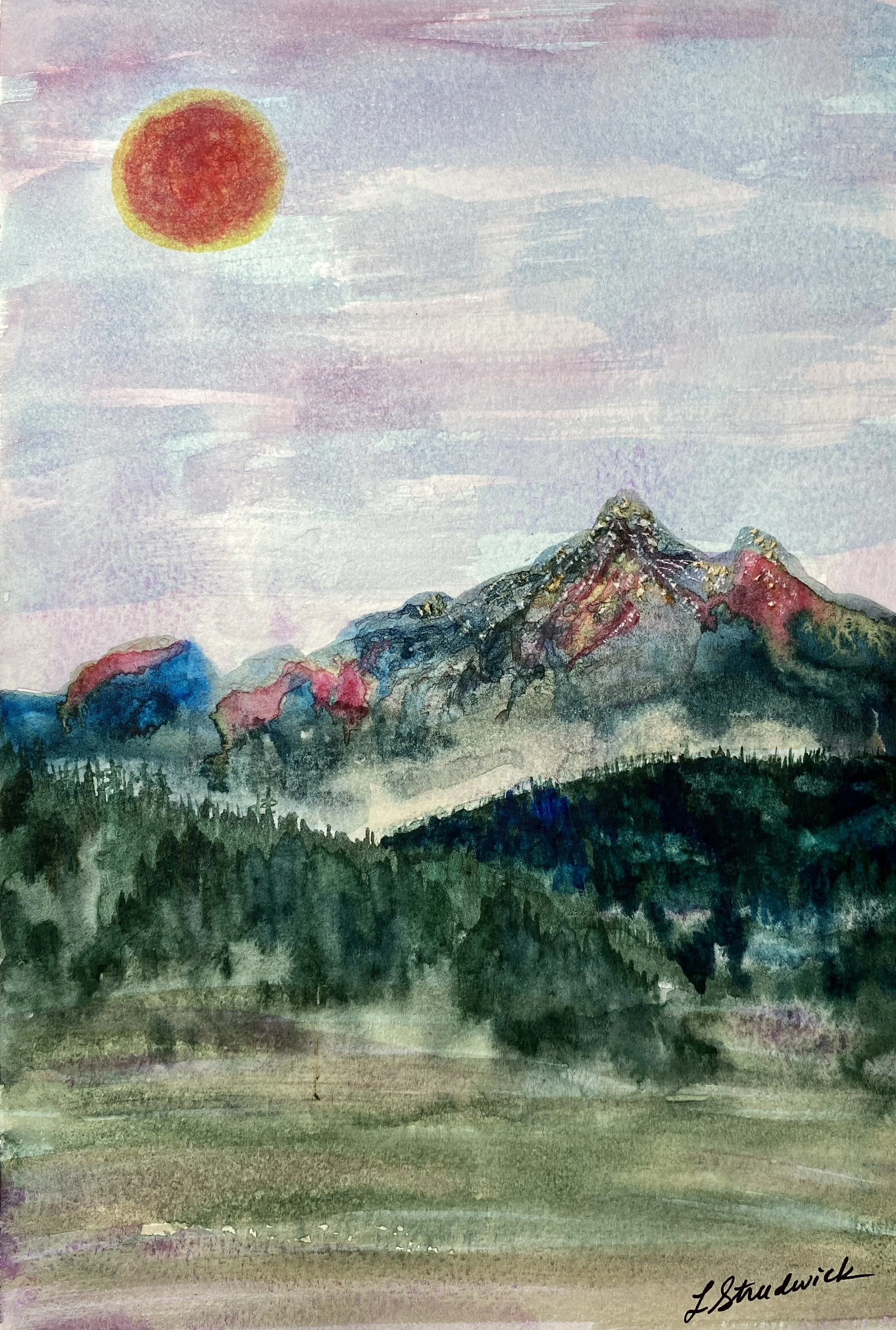 colorful mountains with red-orange sun