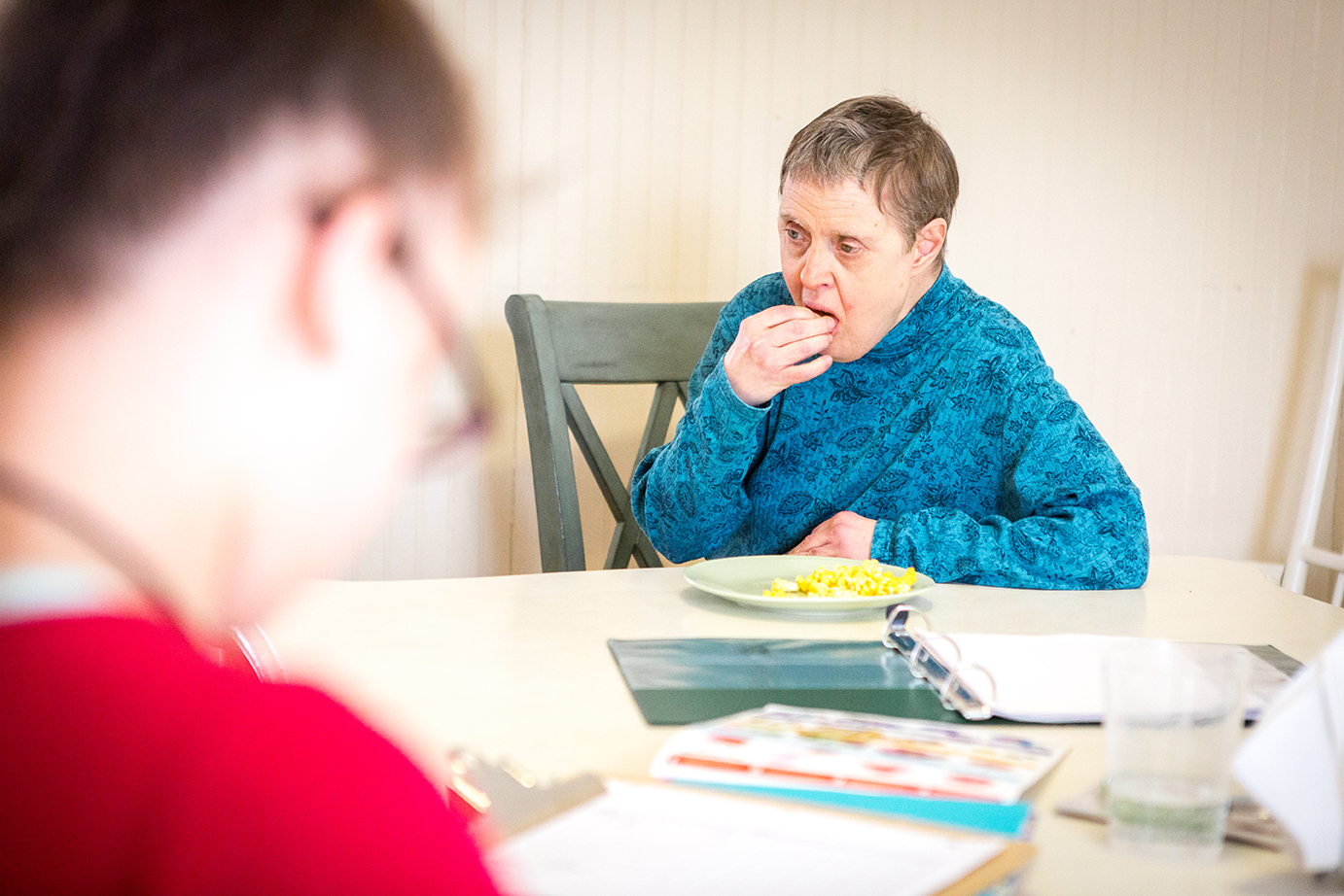  Kim enjoys a snack after helping prepare for dinner at Seven Hills. Kim’s successful transition to her new home wasn’t an easy process for Kris, who compares the change to sending your kids off to college. 