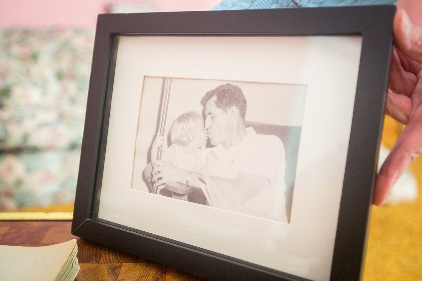  A framed photo of Kim and Rollin when they were younger. After nearly eight years of traveling back and forth from Ohio to care for her father and her sister, Kris now has some of her freedom back in her life. 