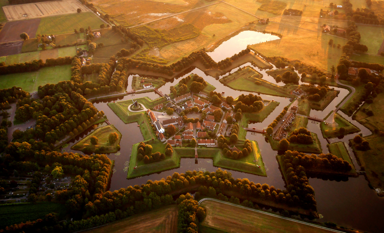 The star fort at Bourtange. Three centuries after the last cannonball was fired in anger at the fort, it now serves as a museum and centre of a sleepy farming village in eastern Holland. The low, thick walls were designed to offset the pounding force of cannonfire.