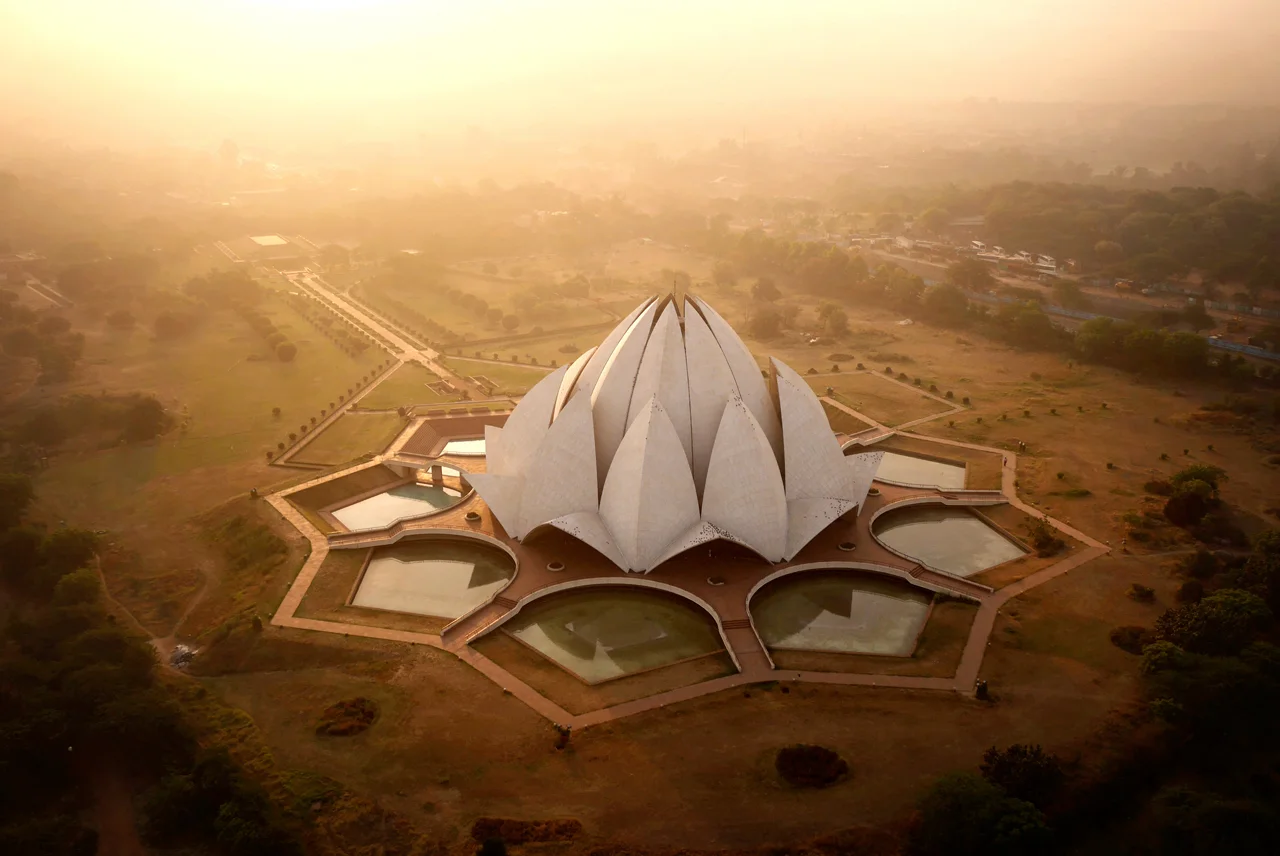 The Lotus Temple, dotted with pigeons at sunrise. Designed by an Iranian exile, the building serves as the centre of the Bahai'i faith in Delhi. Click here for the full gallery.