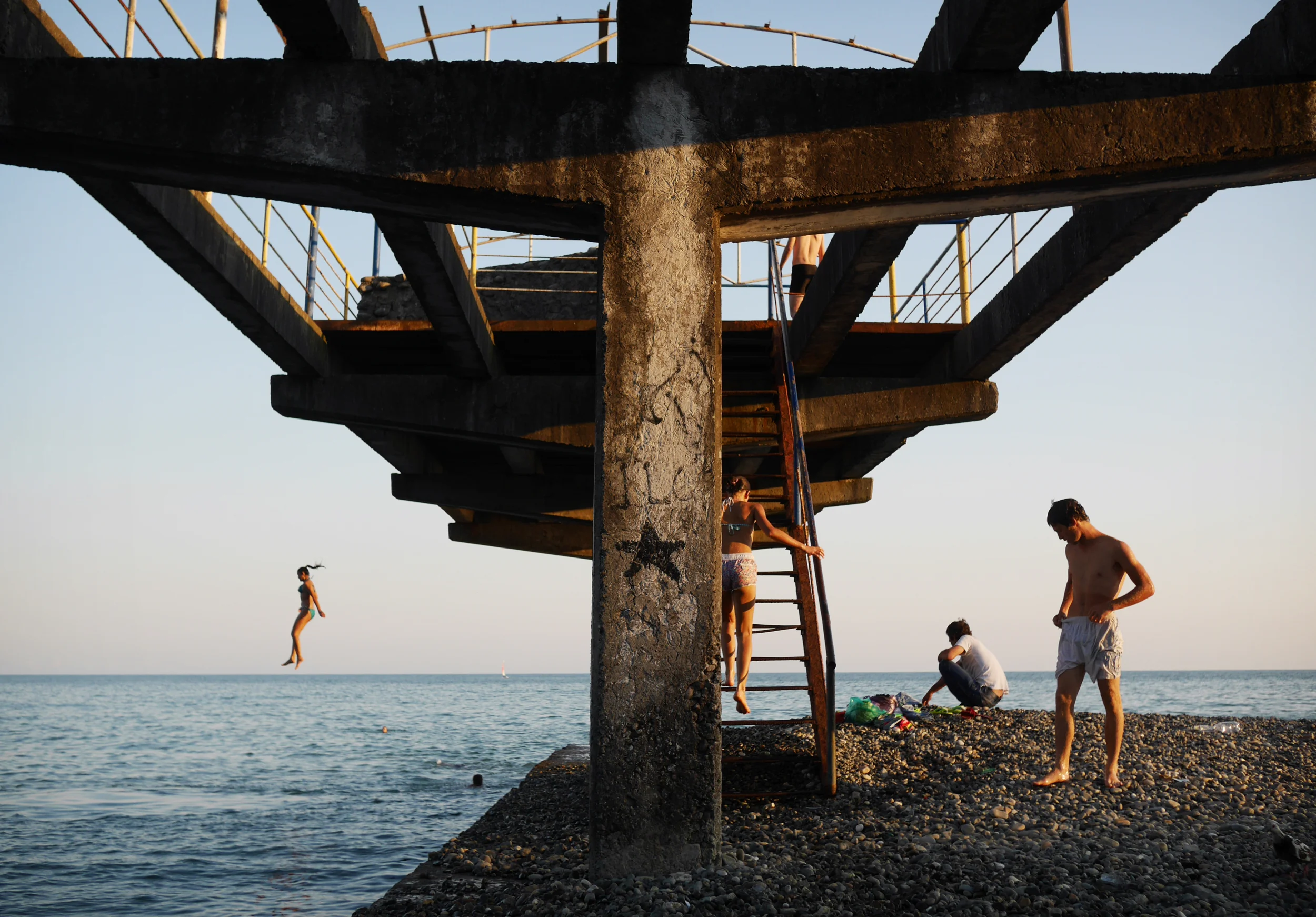 Locals on a ruined pier in Abkhazia, a breakaway republic caught between Russian and Georgian geopolitical ambitions. Pre-war Abkhazia accounted for most of Georgia’s coastline and was famous as the Soviet Union's "Red Riviera". Following the war, international sanctions and a naval blockade devastated the region's economy. Today it is a contrast of natural beauty and ravaged infrastructure. 