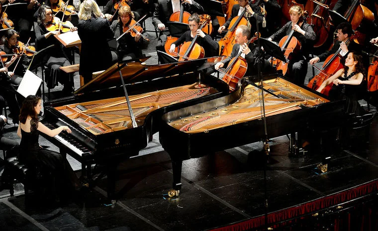 Twins in synch with each other and Maryland Symphony Orchestra