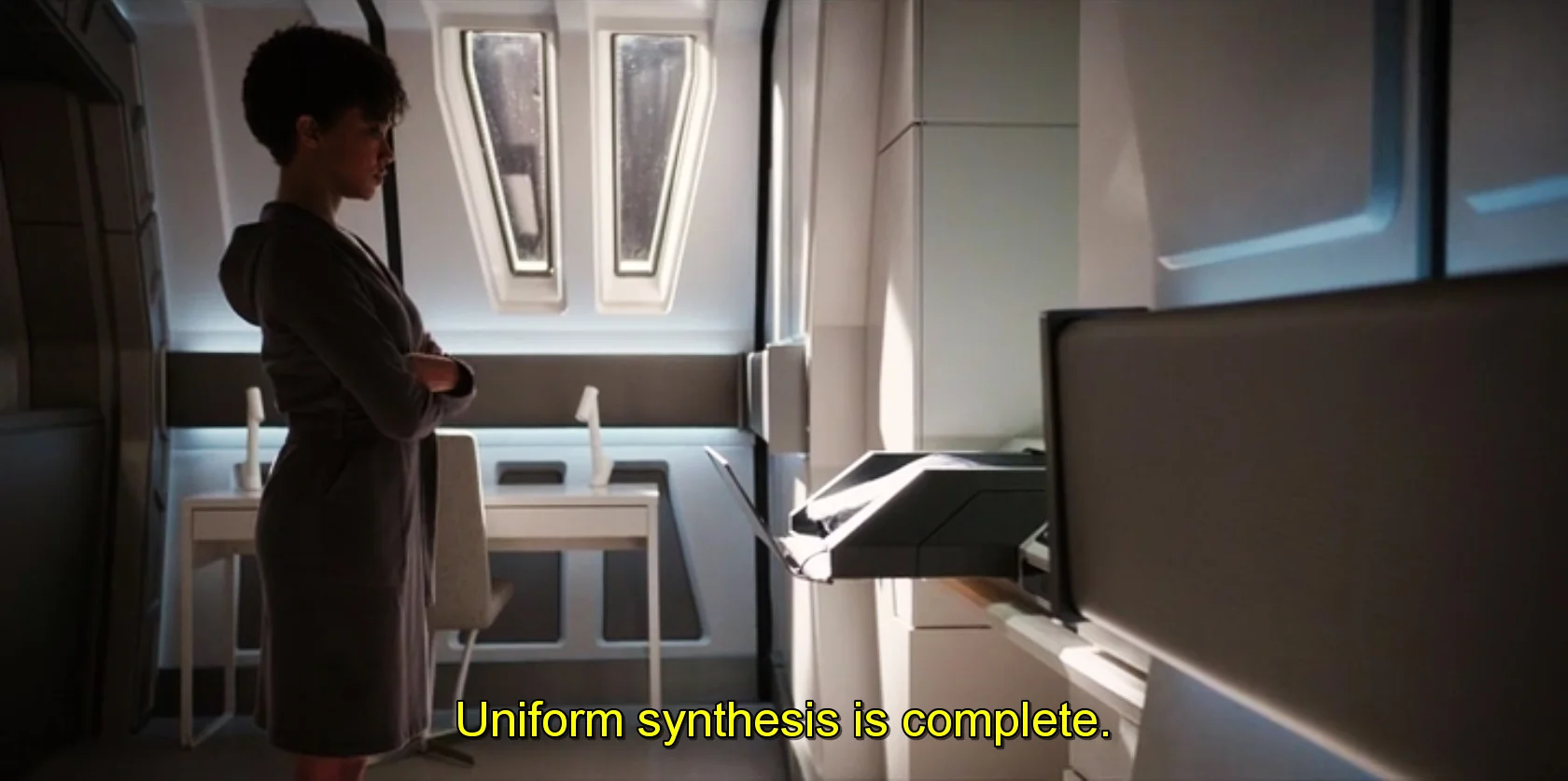 Lt. commander Michael Burnham (Sonequa Martin-Green) receives her new uniform made by a replicator (episode 4).