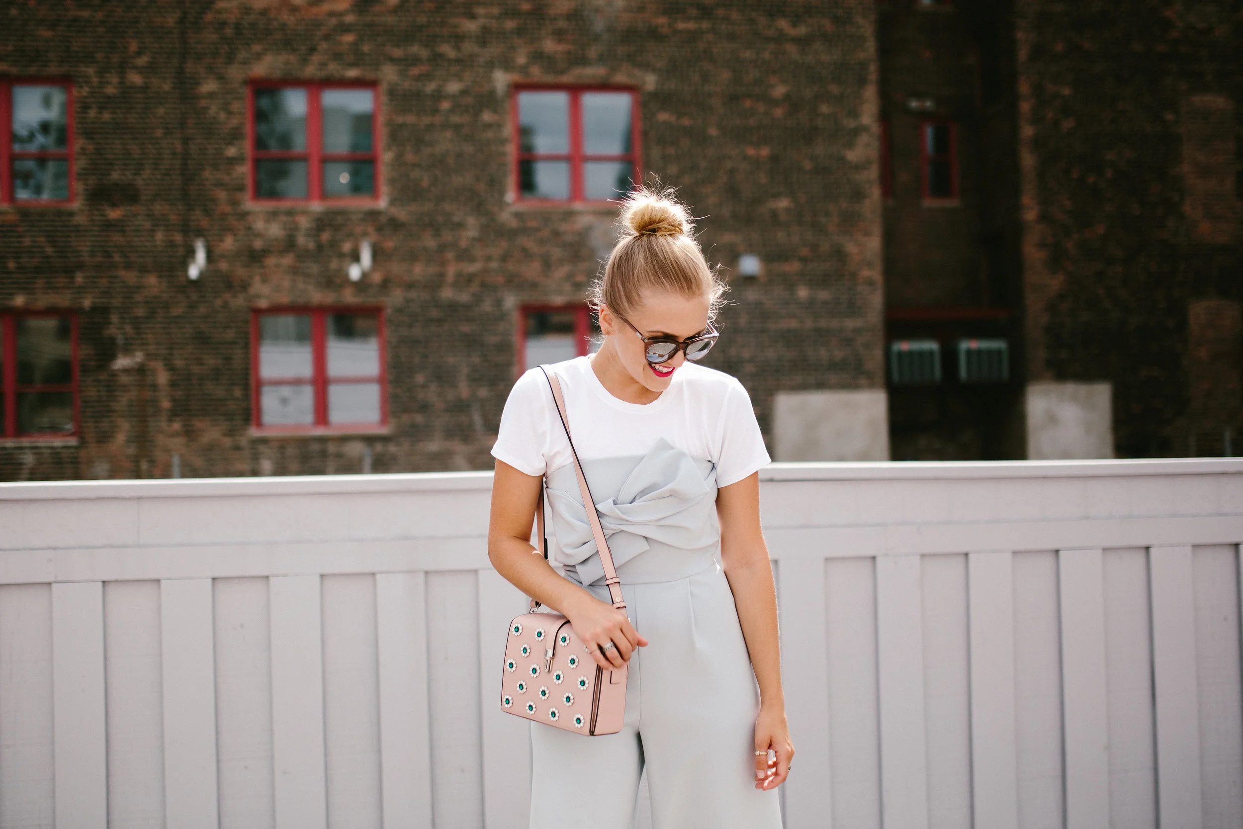 blue jumpsuit embellished bag