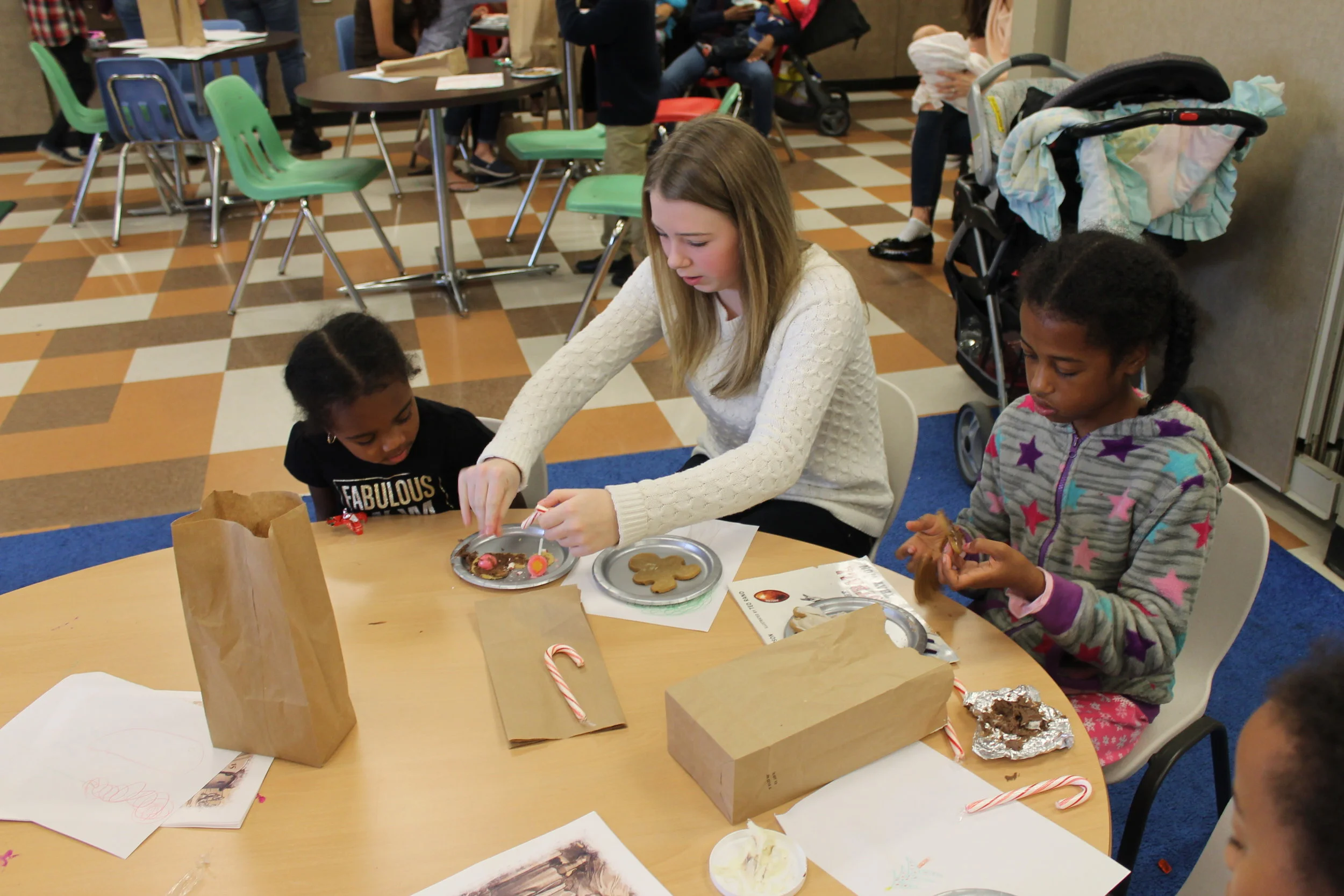  Chloe Peiffer assisting with cookie decor.