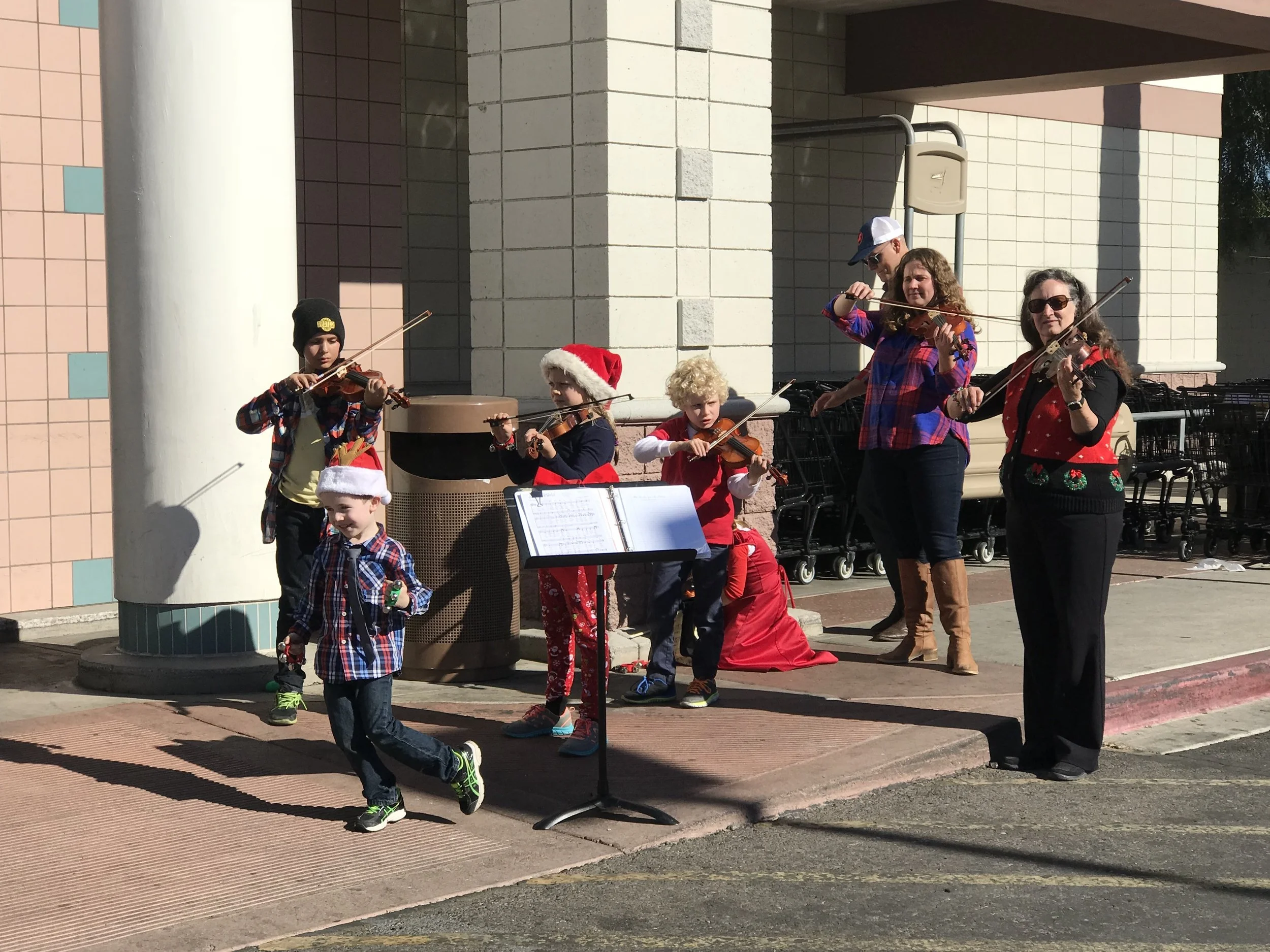 Carol and Brad Routh orchestrated their grandchildren to play Christmas carols encouraging the busy shoppers to stop, listen and donate to the Salvation Army Red Kettle.