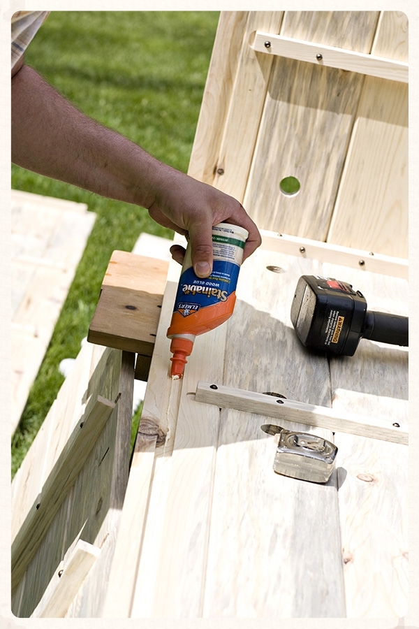Lay a bead of glue in the long dado (groove) that runs along the bottom edge of the Side panel.