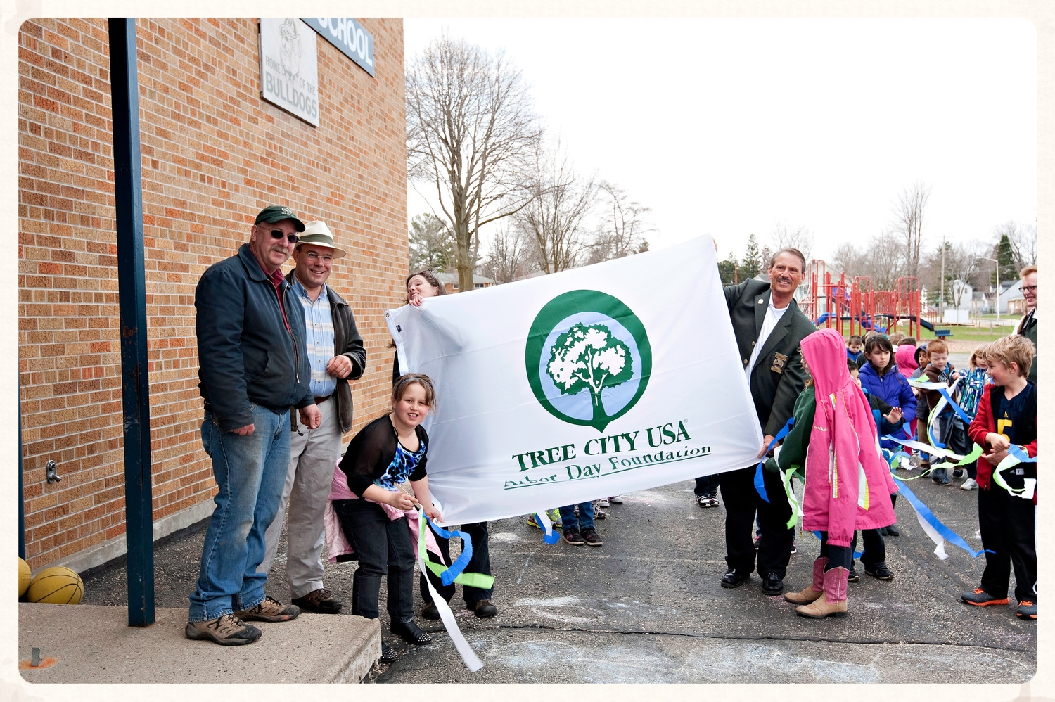 Arbor Day at Washington Elementary School with John Neumann (city forester), Jonas Zahn (Northwoods Casket Co.), Olivia Witthun (WI-DNR Urban Forestry Division), and Mayor Tom Kennedy.