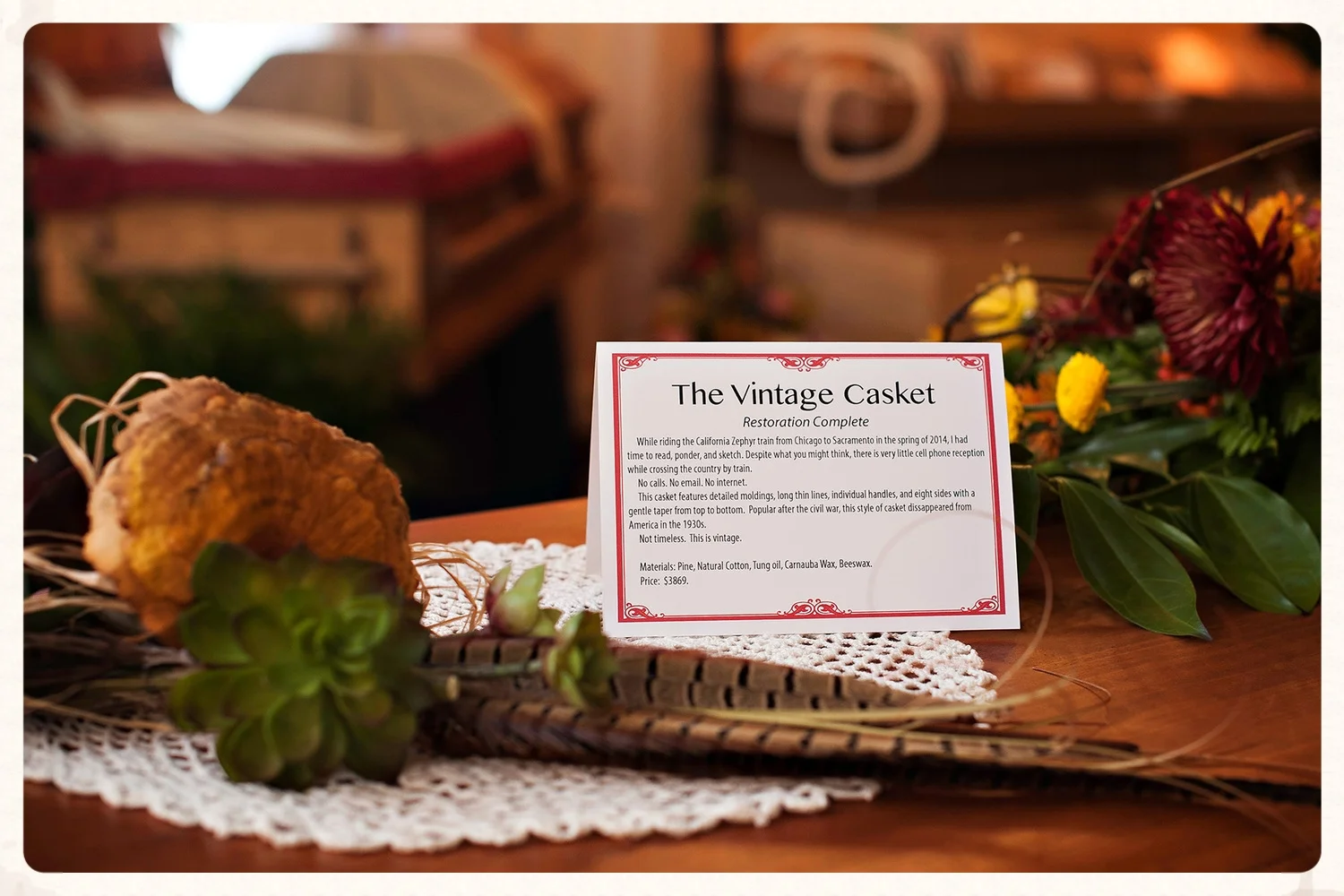 The gallery features fine handcrafted caskets, furniture, and photography art on canvas.