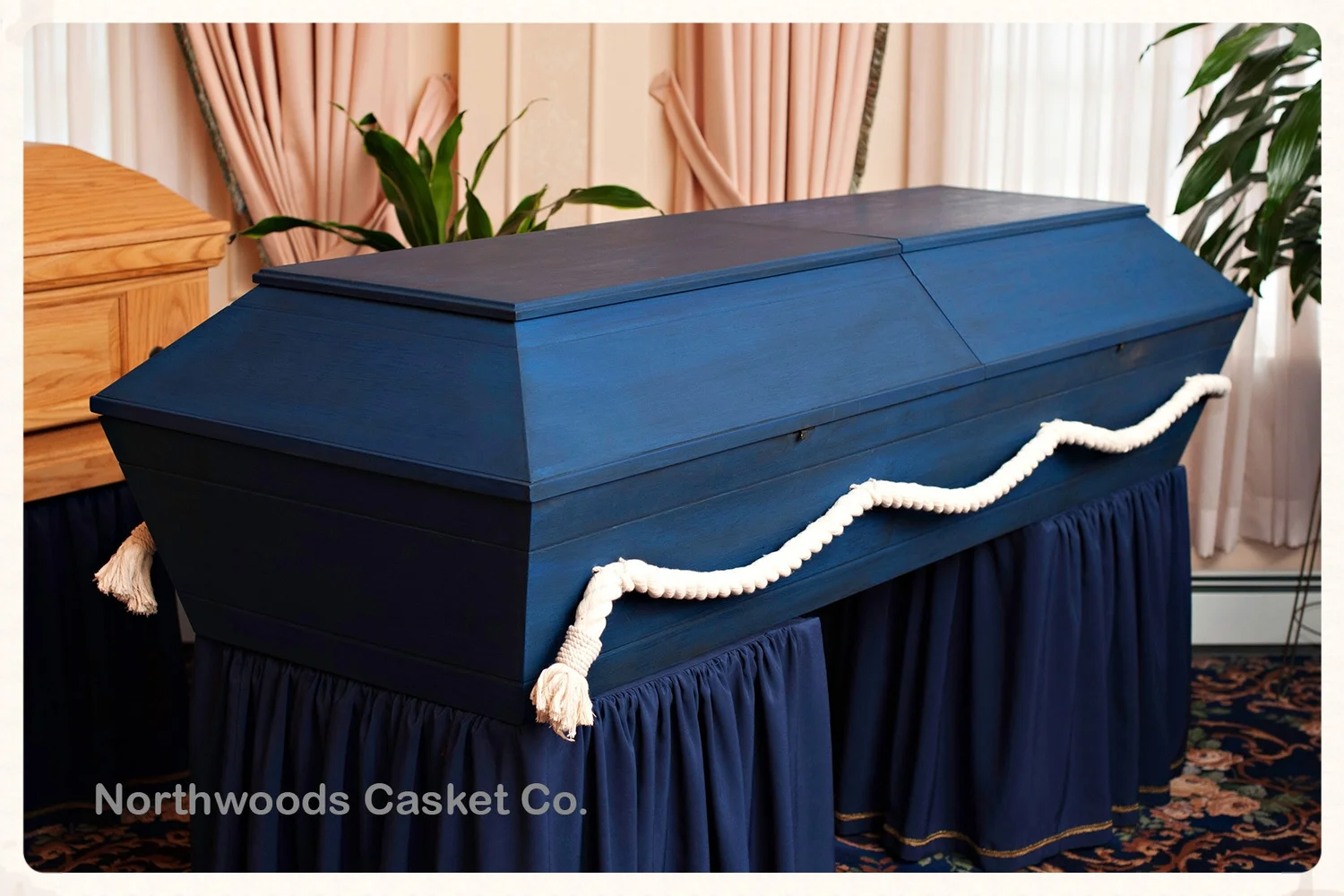 This casket was painted with two coats of blue milk paint followed by two coats of dark raw tung oil for a rich ocean water affect.