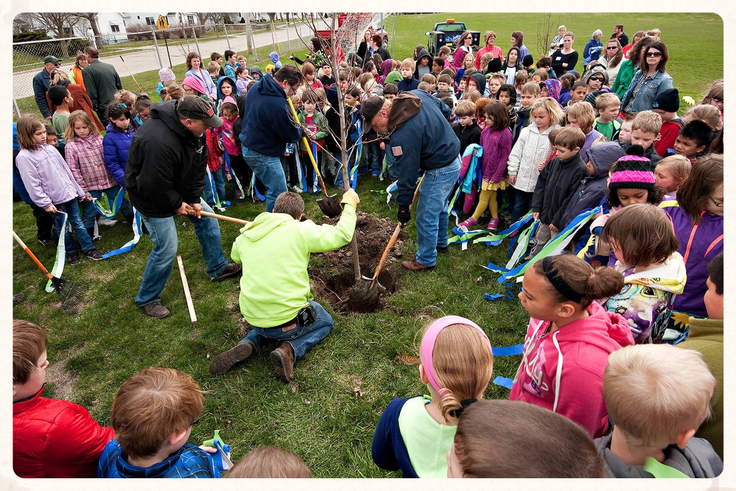 Planting trees with kids for Arbor day at Washington Elementary School.