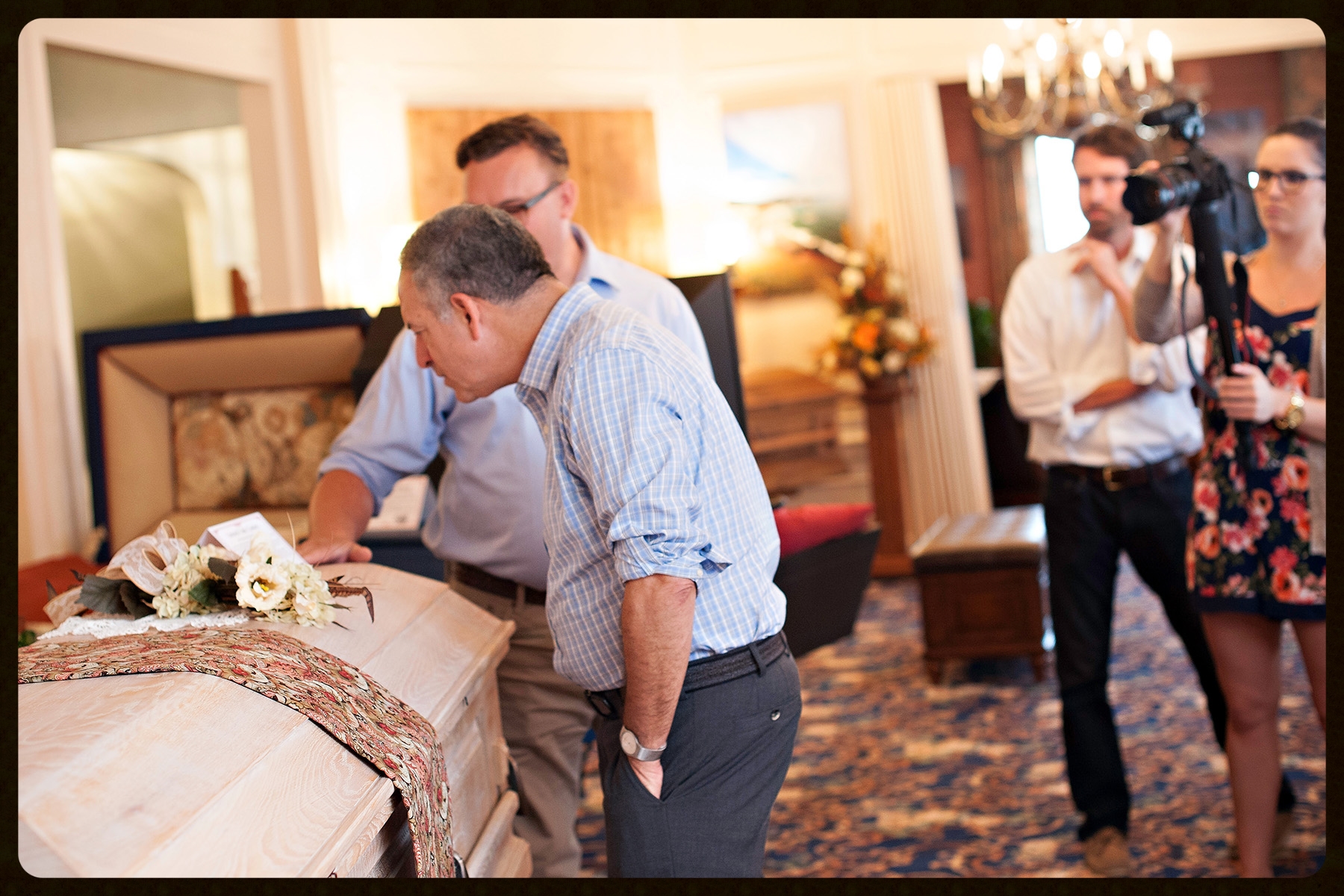 Russ Feingold learning about an historic 100% non-toxic "limed oak" finish on a casket made from locally sourced, sustainable Wisconsin red oak.
