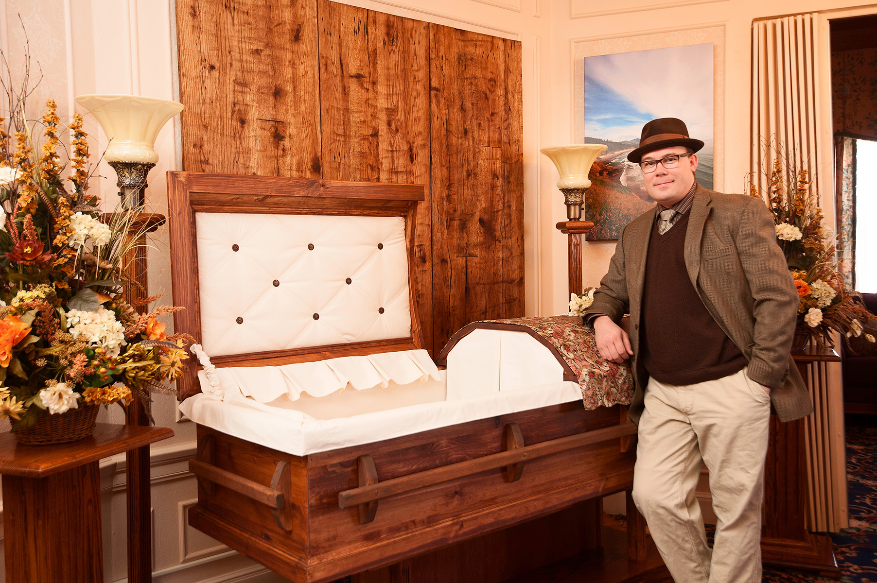 Jonas Zahn pictured with a 100% metal free pine casket--one of more than 75 different styles the company crafts here in Wisconsin.