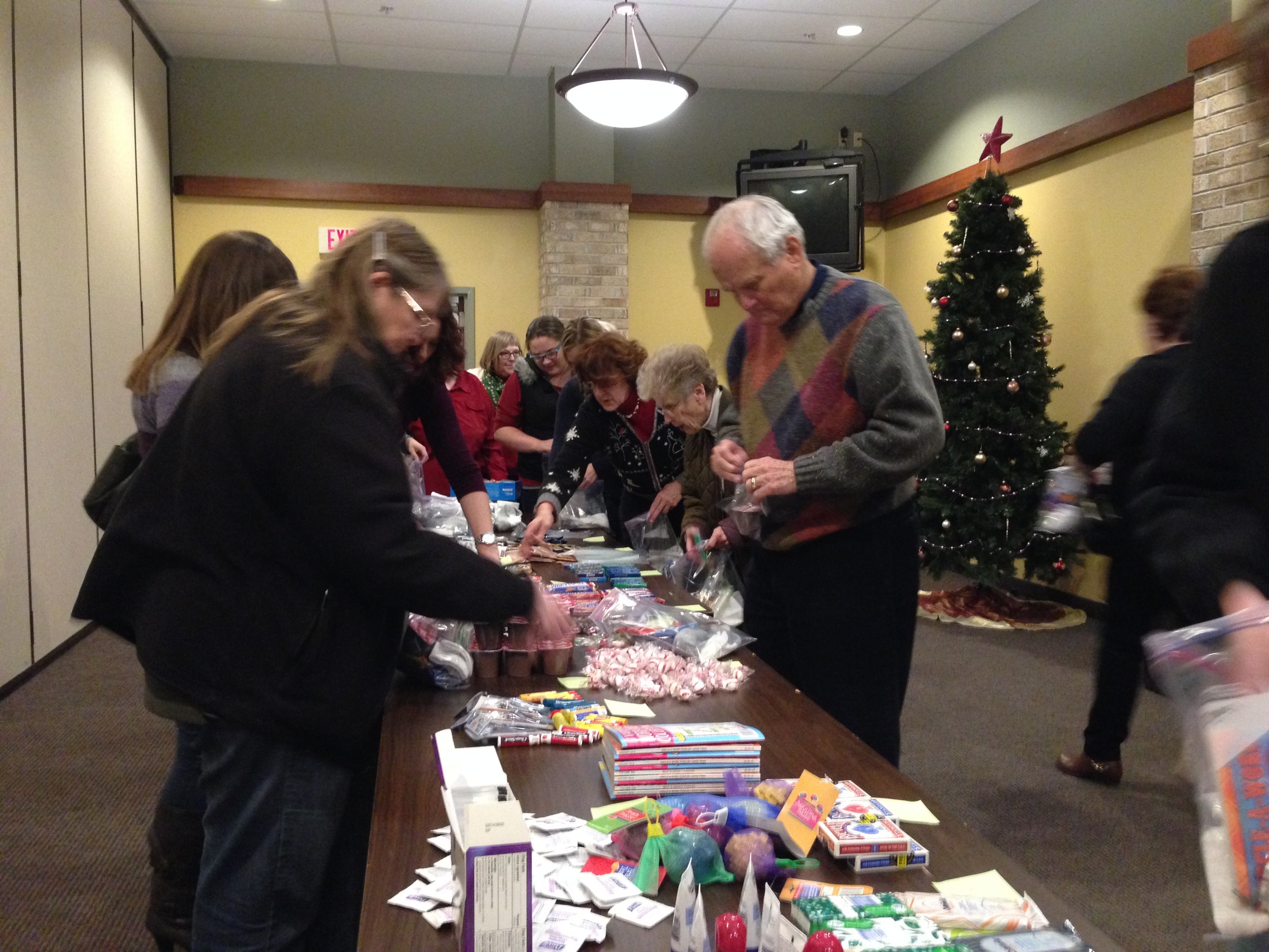 Stuffing care bags for Troops