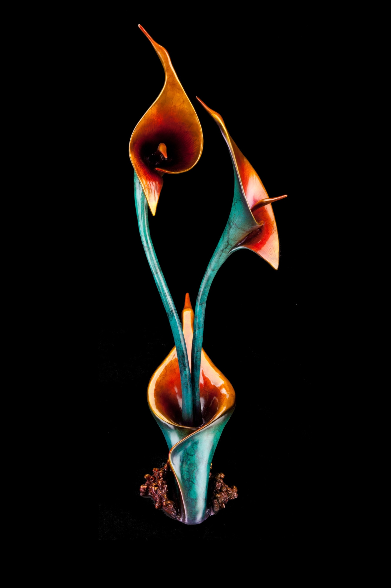  Rebirthed Flight , Bronze, 26.5” H x 9" W x 13.5" D, Edition of 35: When we are happy, excited, curious, or passionate about something, our spirit blossoms, takes flight, and soars. To help manifest that rebirth of joy and energy in our lives, this sculpture contains five flying bird heads and three blossoming calla lilies.