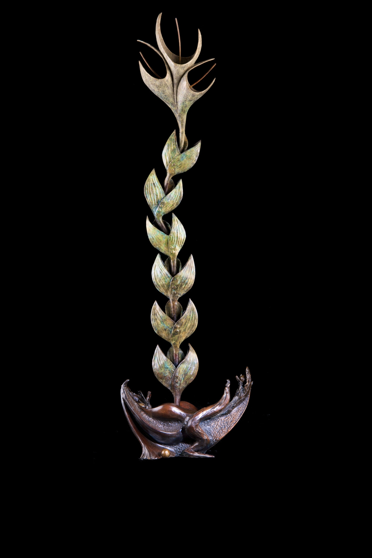 Earthbloom , Bronze, 39” H x 11.5” W x 9” D, Edition of 35: A flower—similar to others but as unique as each of us viewing it—blooms out of the mysterious earth, forever reaching towards the Sun, one of its sources of Life.