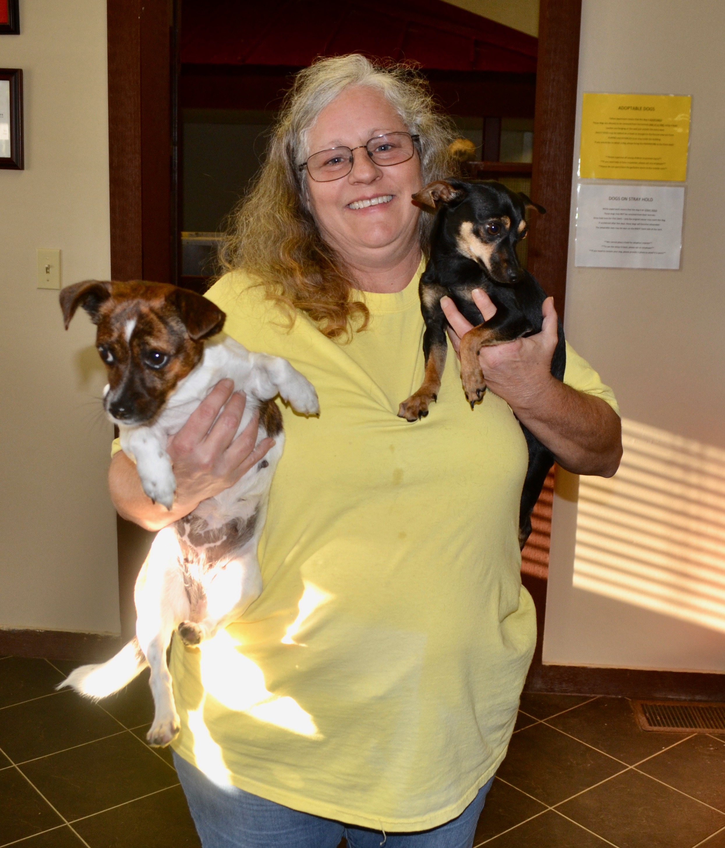 Deanna Domingue, another foster parent with newly enrolled pups Jimi (on right) and Janis (on left). 