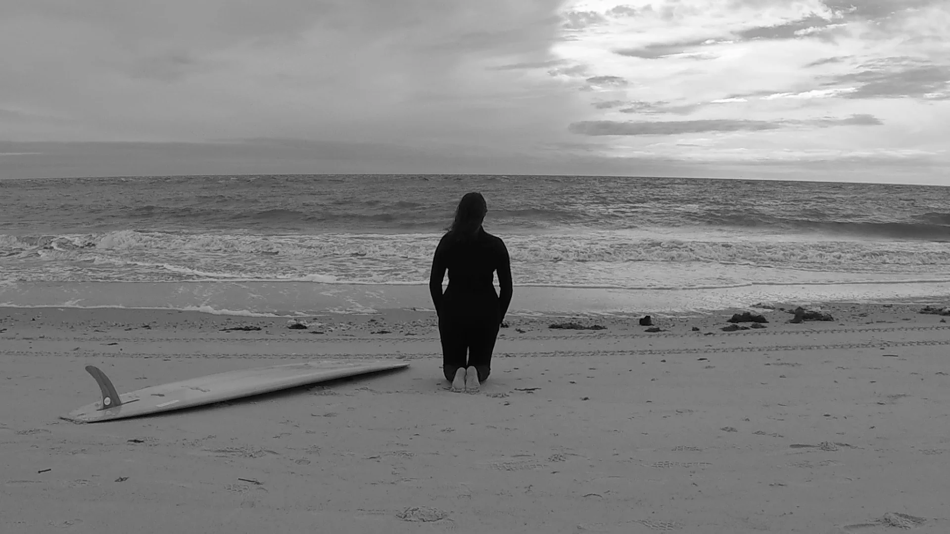 kneeling surfbaord ocean screenshot.jpg