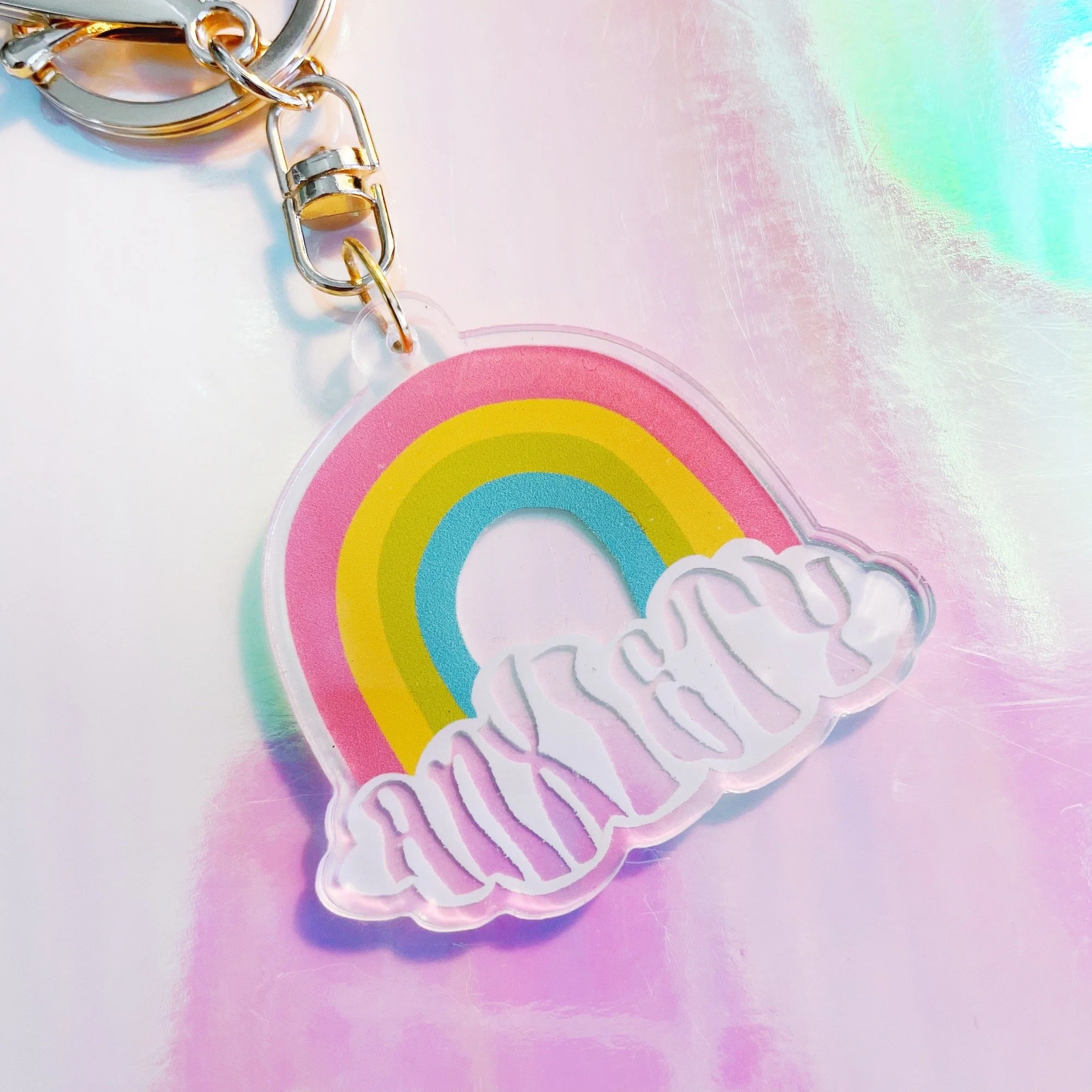 acrylic keychain with anxiety rainbow illustration and gold chain