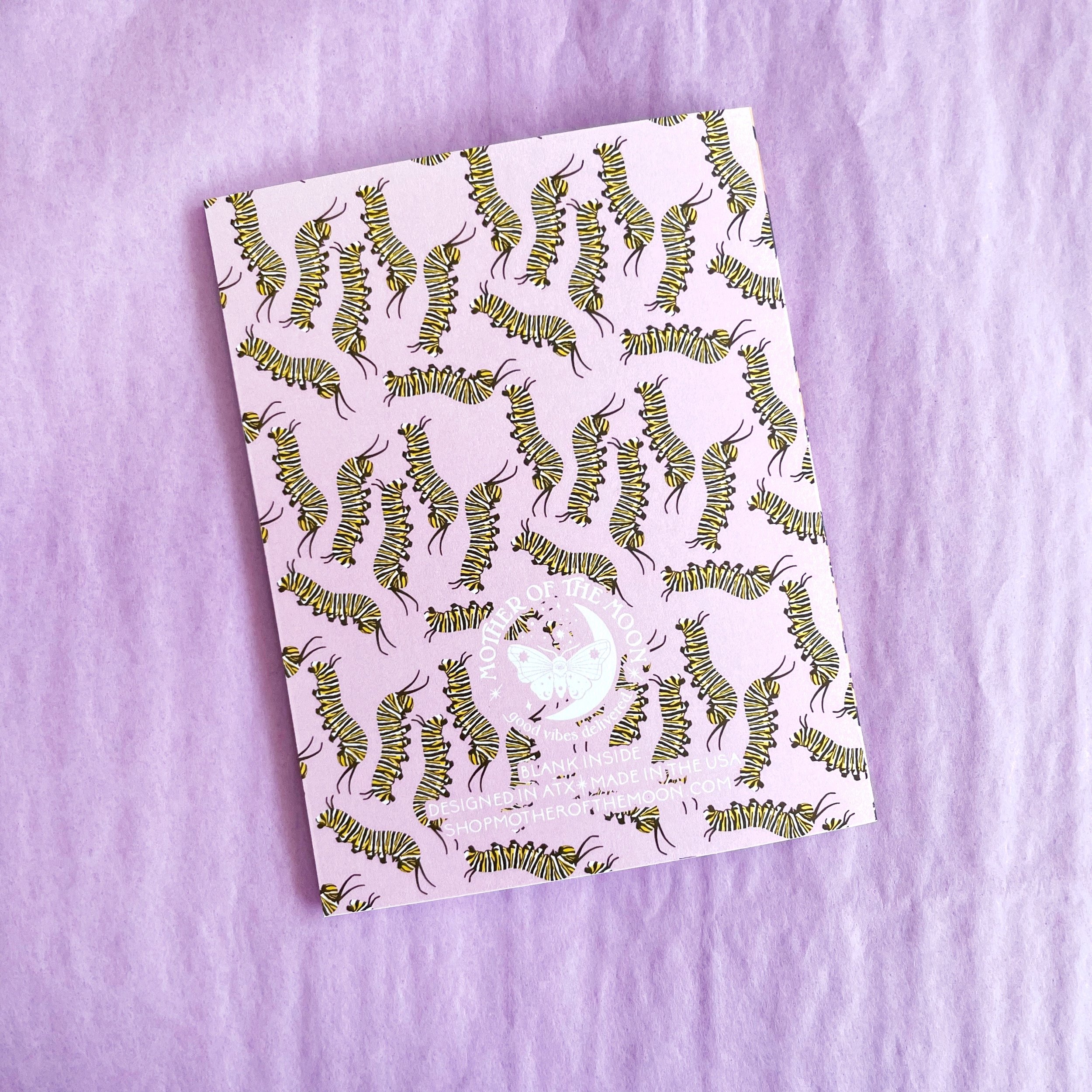 back of greeting card with caterpillars on a lavender background