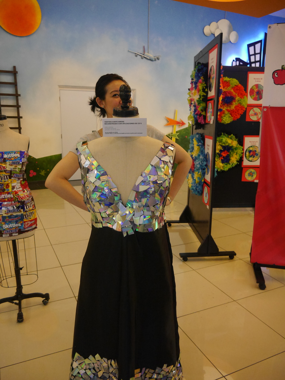  Grace modeling a dress made from broken CDs. 