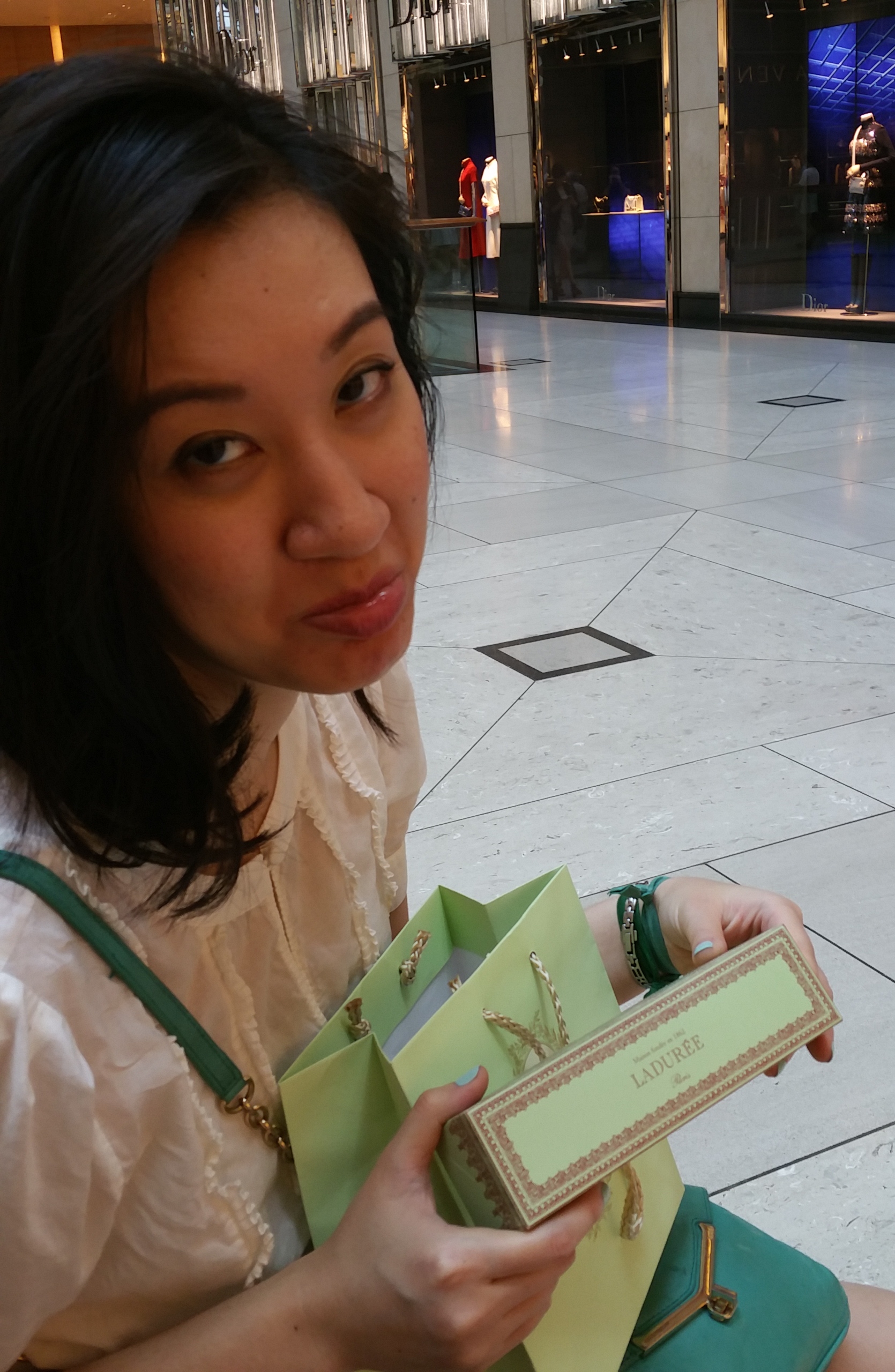 For a little backstory: the BDT is about 77 to 1 USD. The HKD is about 7.7 to 1 USD. So I kept making order-of-magnitude errors in my head. Grace is making a sad face because we accidentally spent $40 on 8 macarons. Oops.