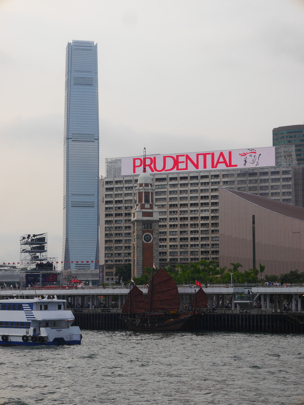  The tallest building in Hong Kong, the  International Commerce Centre  on the left with the  Tsim Tsa Tsui clock tower  in front (used to be a part of a rail terminal). 