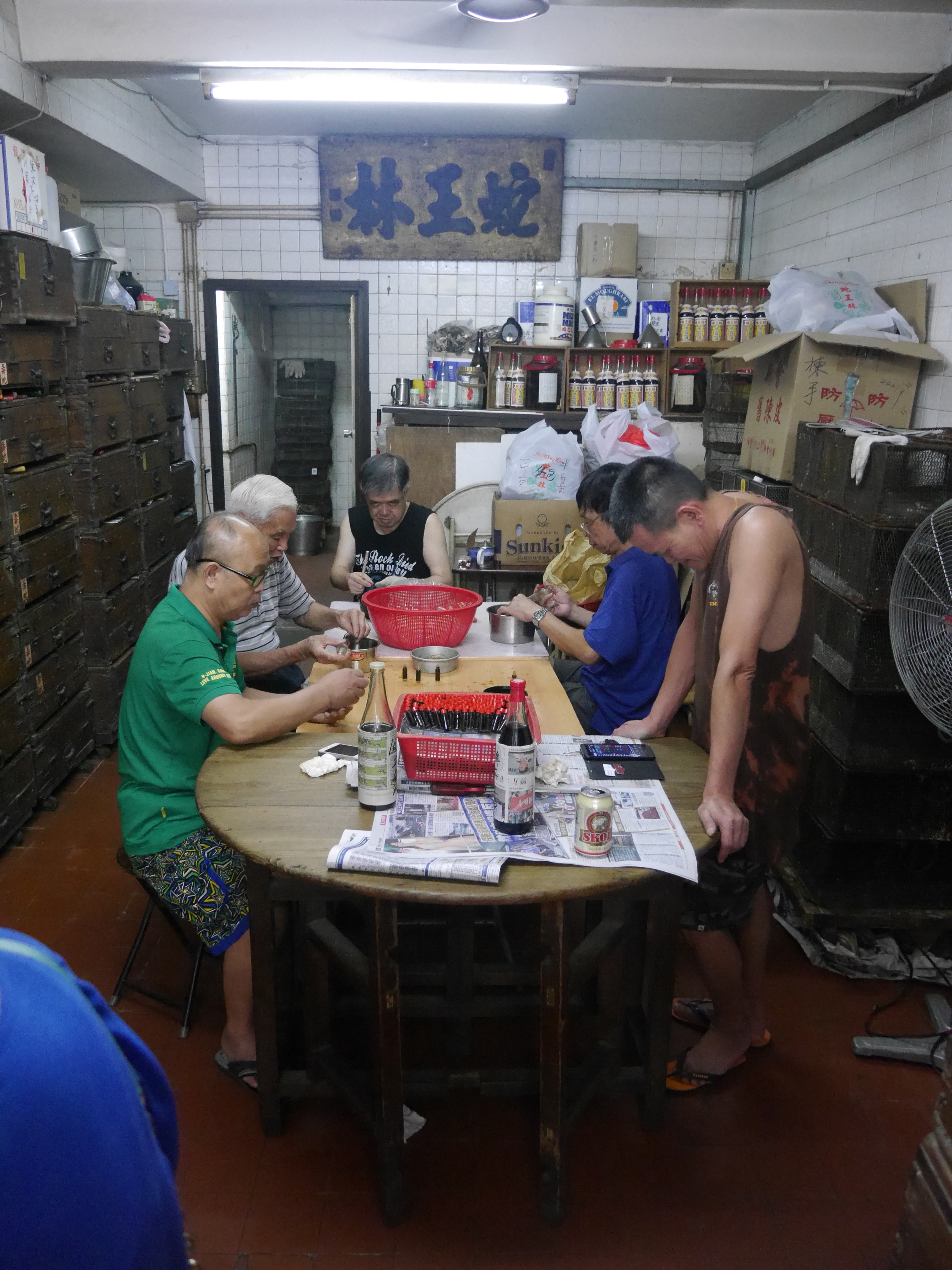  Shop employees. Making gall bladder extract, I think. 