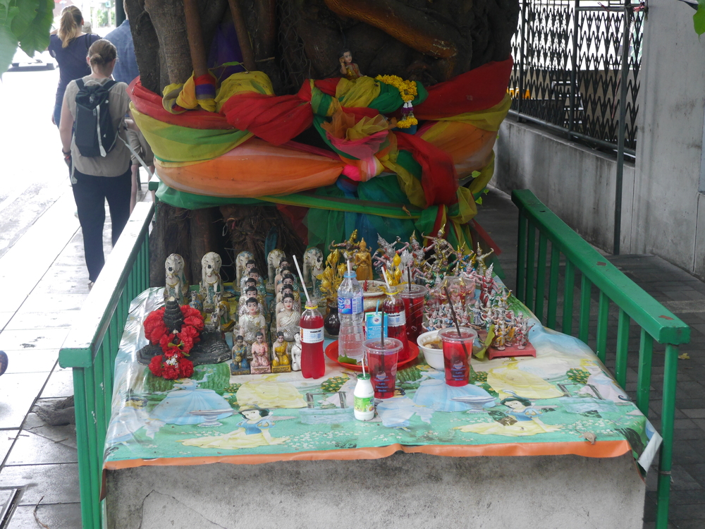  A shrine/area for offerings. Apparently red has significance, so people will leave random red drinks, in addition to other things. 