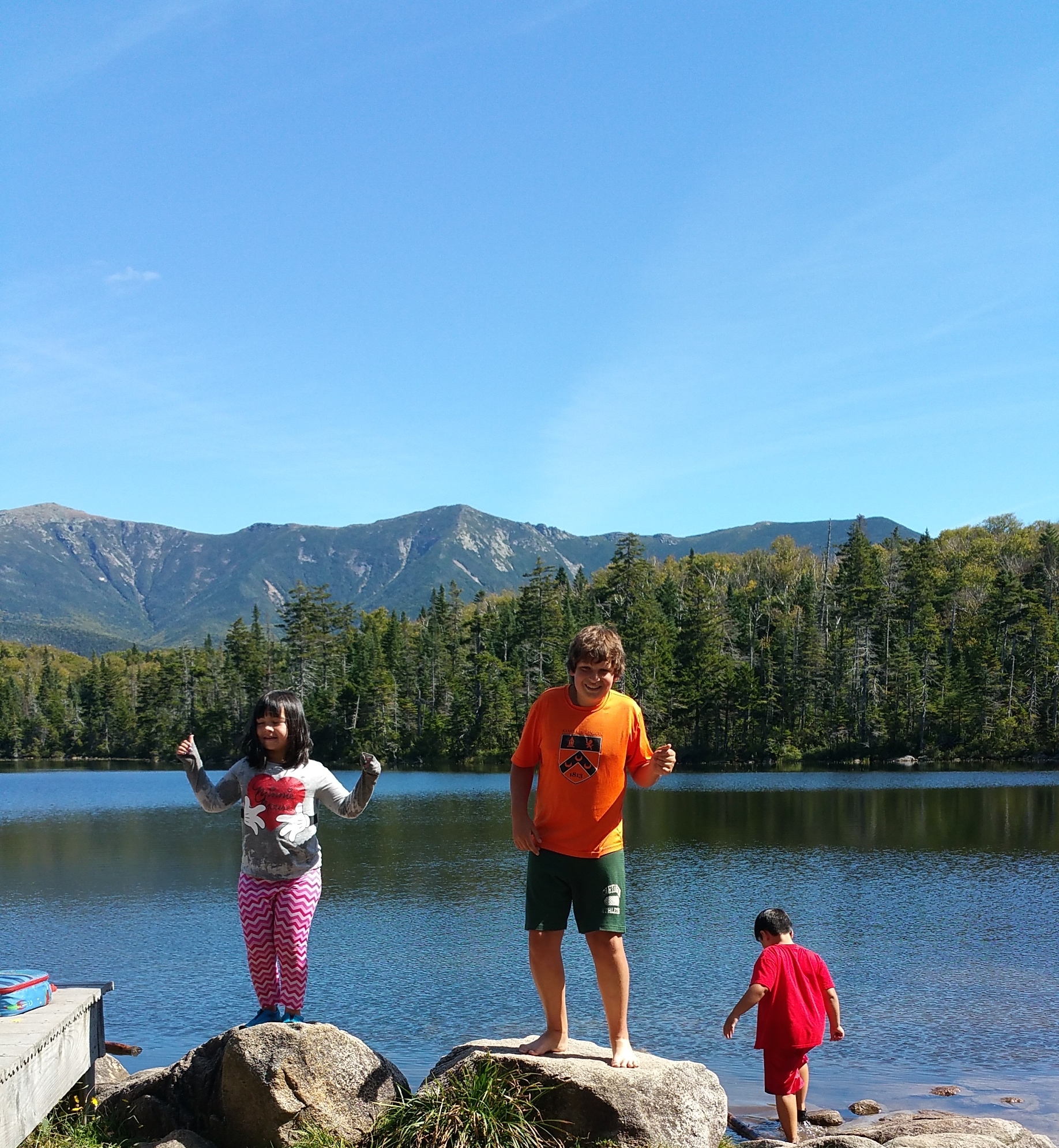 Inspired by the beauty of Lonesome Lake and the surrounding mountains, Nina and Cole belt out an original song! woodland commmunity school once again took to the trails as we hiked to lonesome lake. it was a gorgeous day for a hike with many interesting geographic features and critters to notice along the way. once we reached the lake many students opted to go for a swim or wade in the cool, clear water. students burst into spontaneous song with zoe and cole leading the group singing in "rounds." 