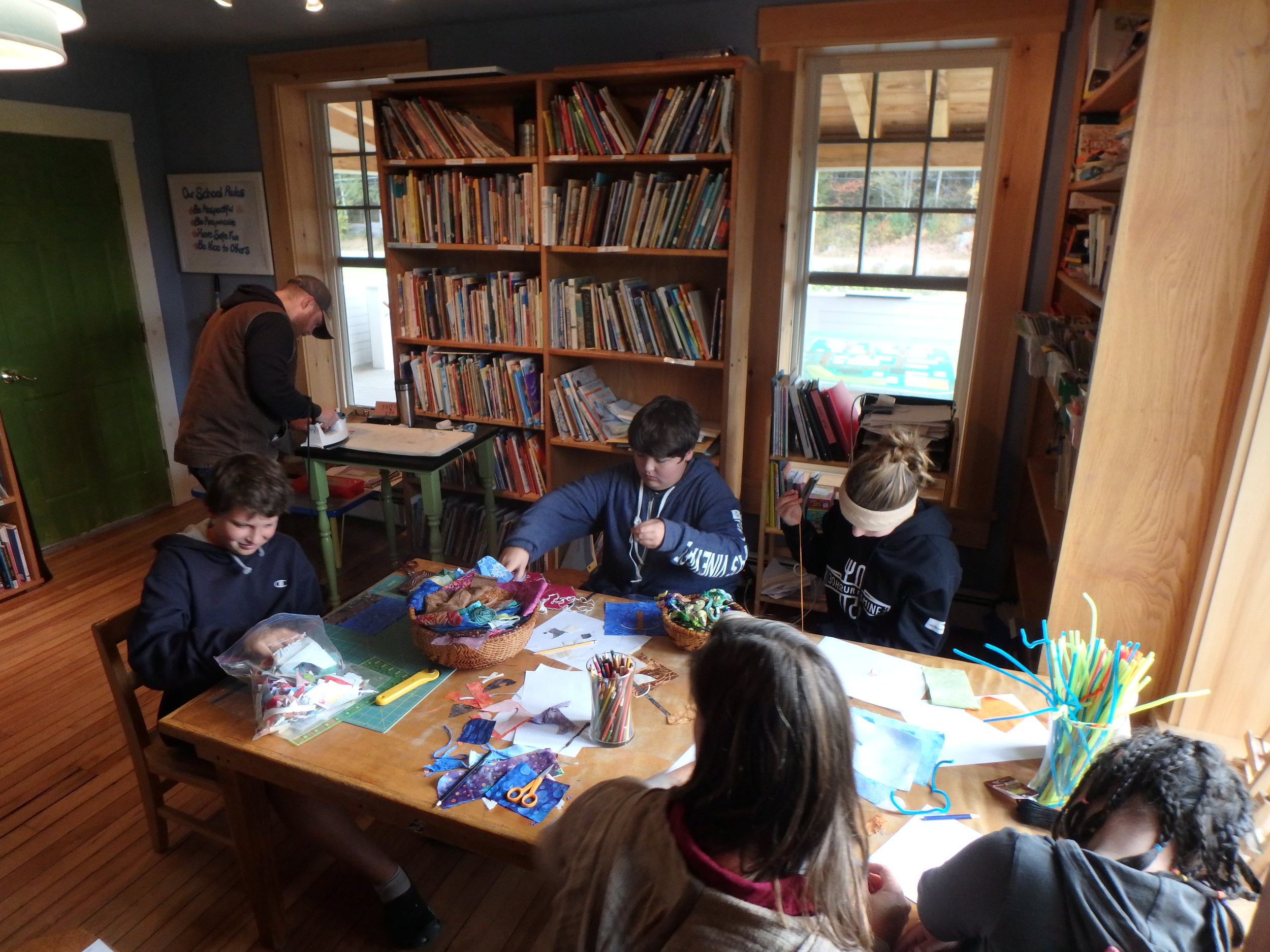 One of our wonderful parents spent time with us teaching the students how to quilt. Each student is designing and quilting his or her own square which will then be turned into a Woodland Community School quilt for 2016. Be sure to stop by and see the progress. Thanks, Jessie!