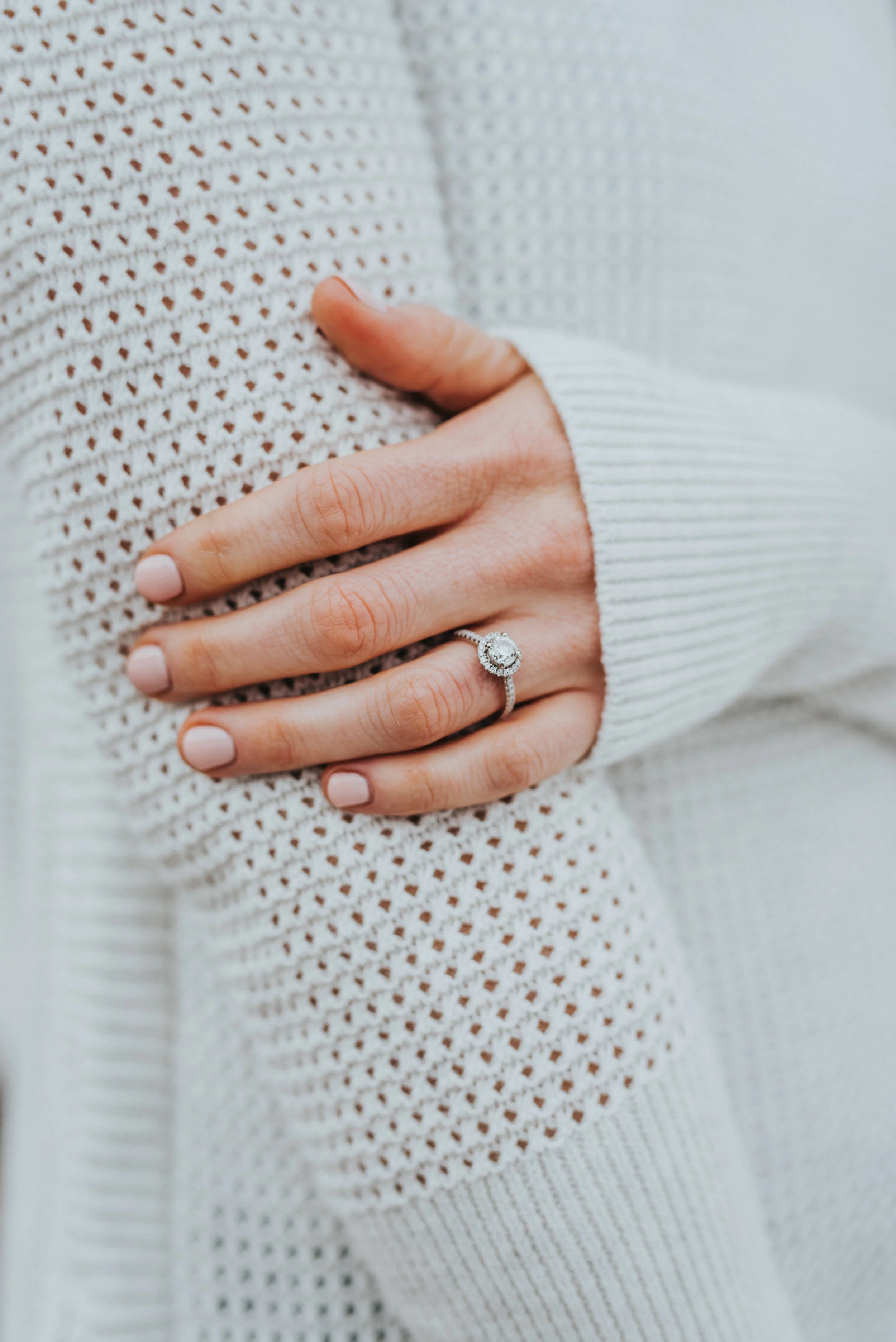  beautiful natural pose showing off the beautiful wedding ring halo wedding ring sweater goals sweater weather winter photo shoot session goals engagement session inspiration utah couple beautiful professional photo shoot session #winter #engagements