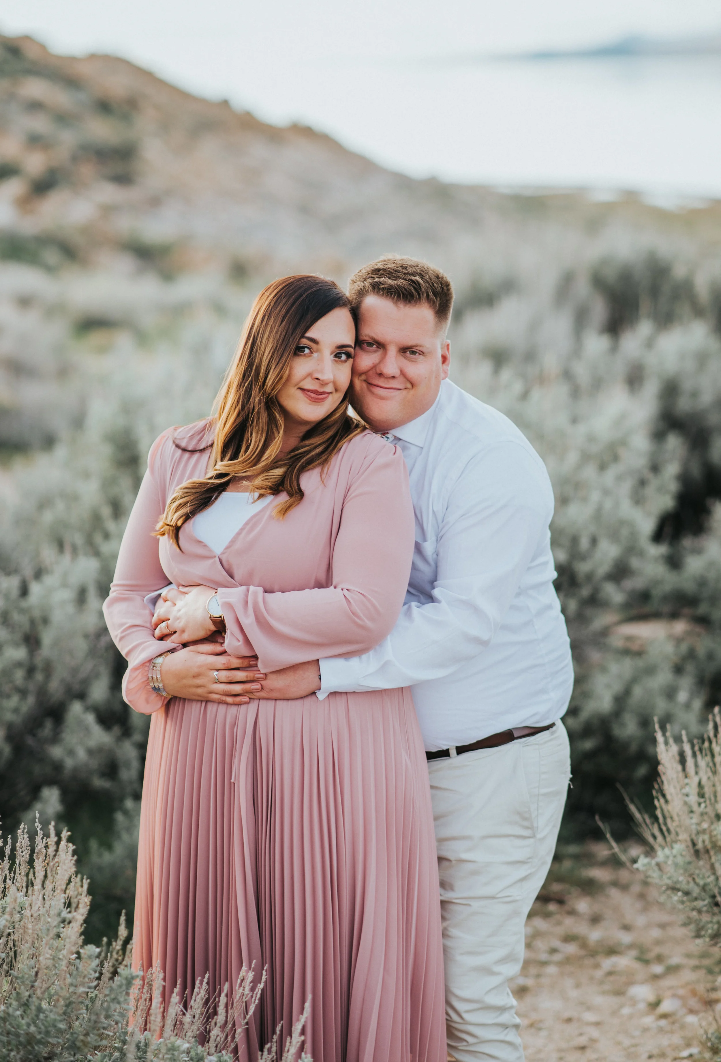  bright warm lighting loving couple beautiful couple pose beautiful soon to be husband and wife utah couple outdoor engagement photo shoot inspiration photo shoot in the sage brush #engagement #antelopeisland #utah #love #soontobehusbandandwife #coup