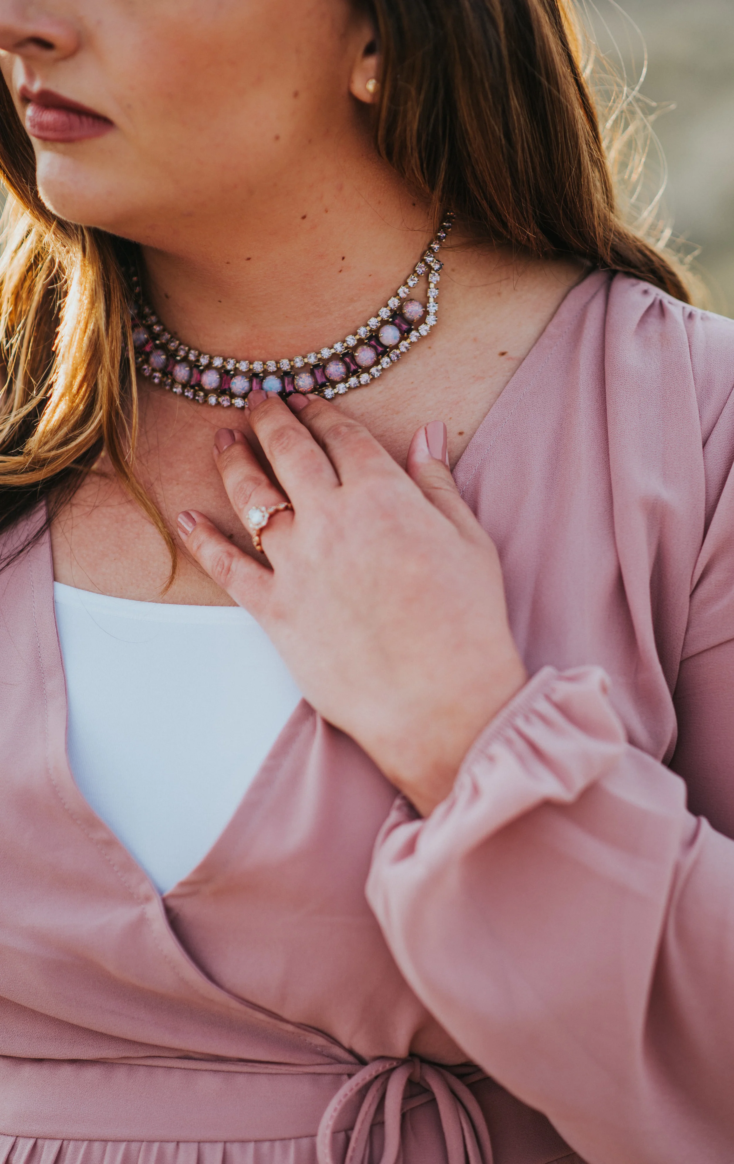  showing off the engagement ring pose inspiration beautiful unique necklace engagement outfit aesthetic inspiration just the soon to be bride professional photo shoot beautiful #engagement #antelopeisland #utah #love #soontobehusbandandwife #couplego