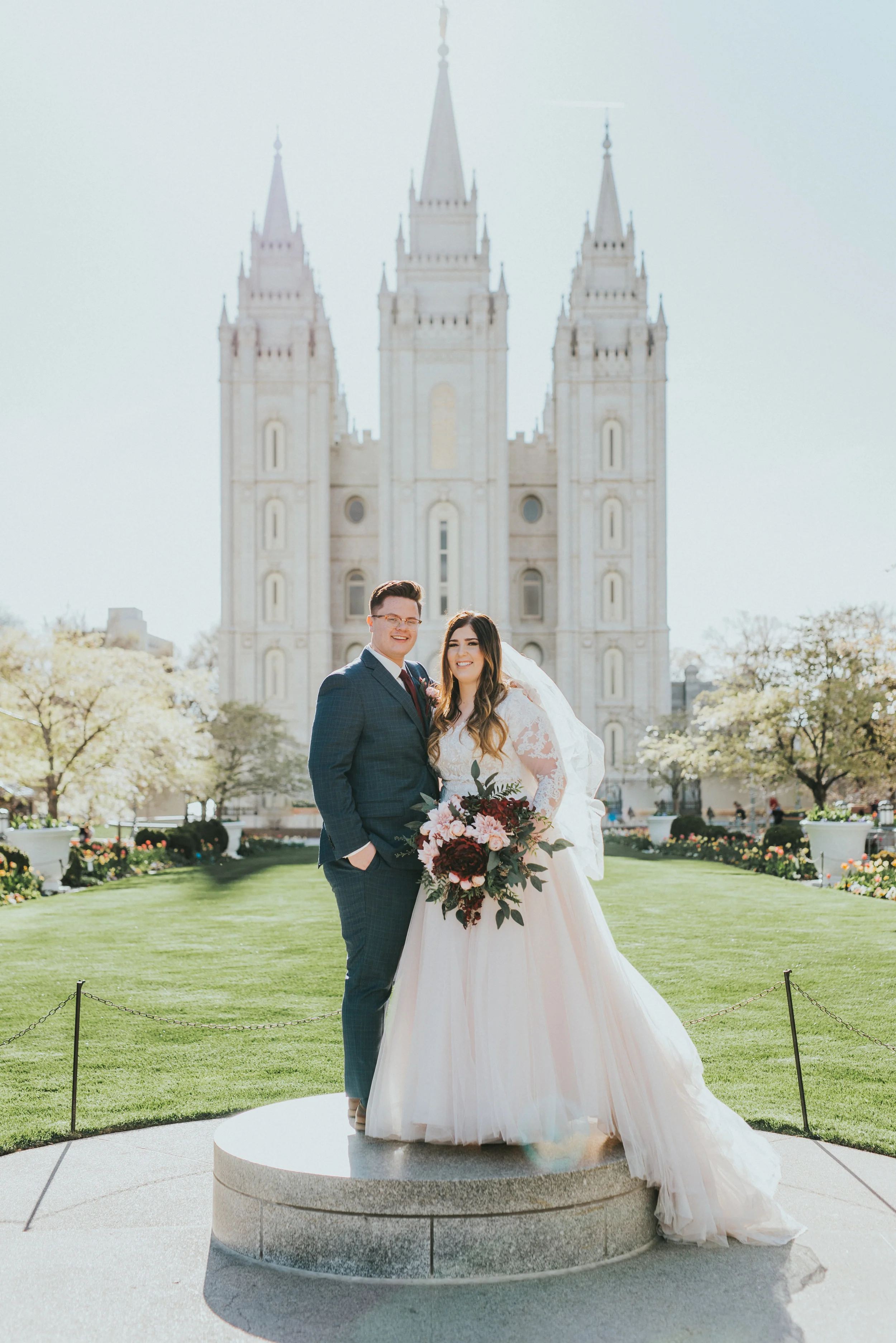  beautiful formal wedding photo shoot in front of the salt lake city temple temple ground photo shoot lds wedding inspiration lds couple mormon couple bright lighting glowing couple wedding bouquet inspiration wedding dress inspiration wedding attire