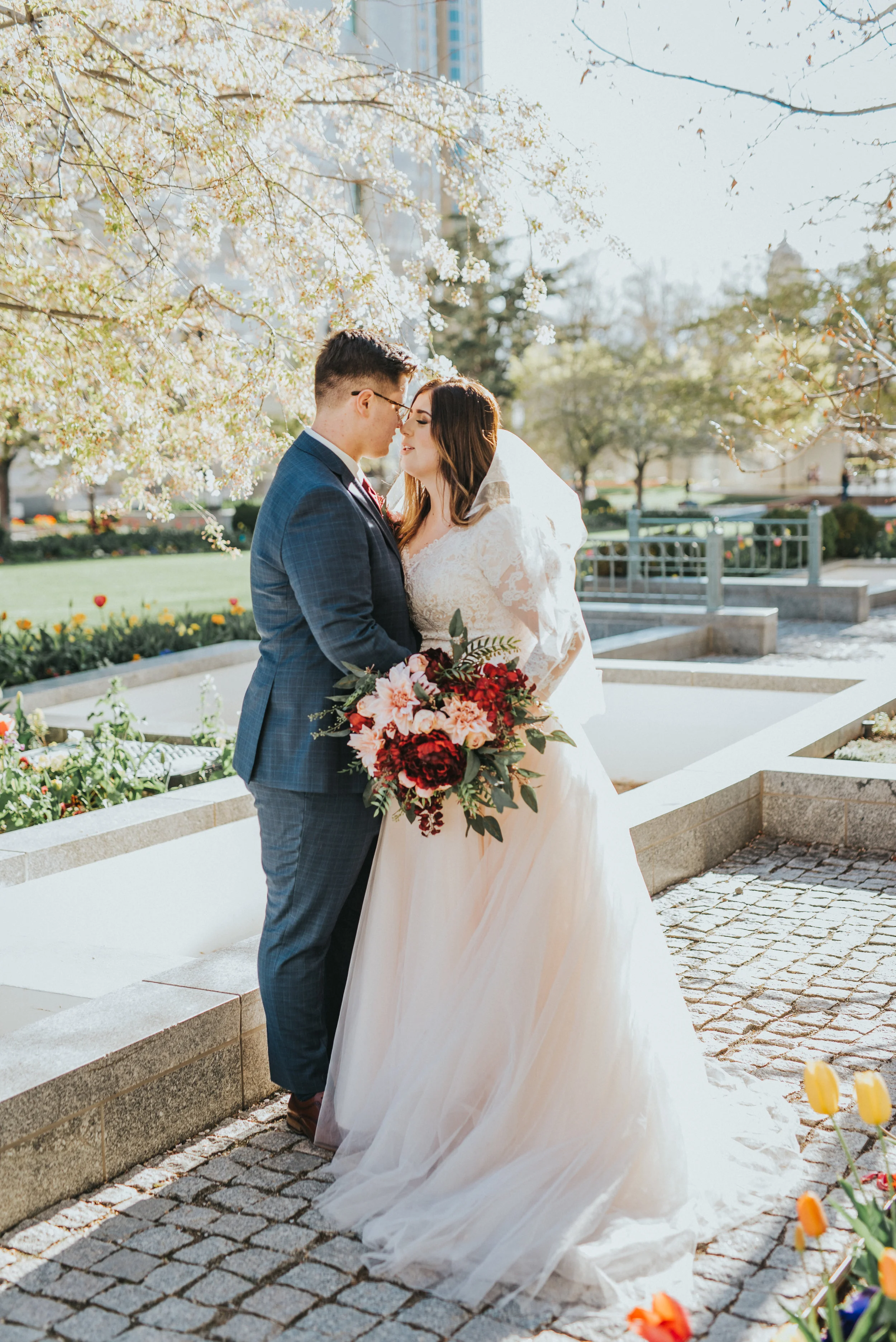  beautiful couple pose inspiration gorgeous bright spring day photo shoot inspiration spring wedding goals gorgeous red and pink bouquet inspiration wedding attire inspiration for modern utah brides formal salt lake city photo shoot session  #ldswedd