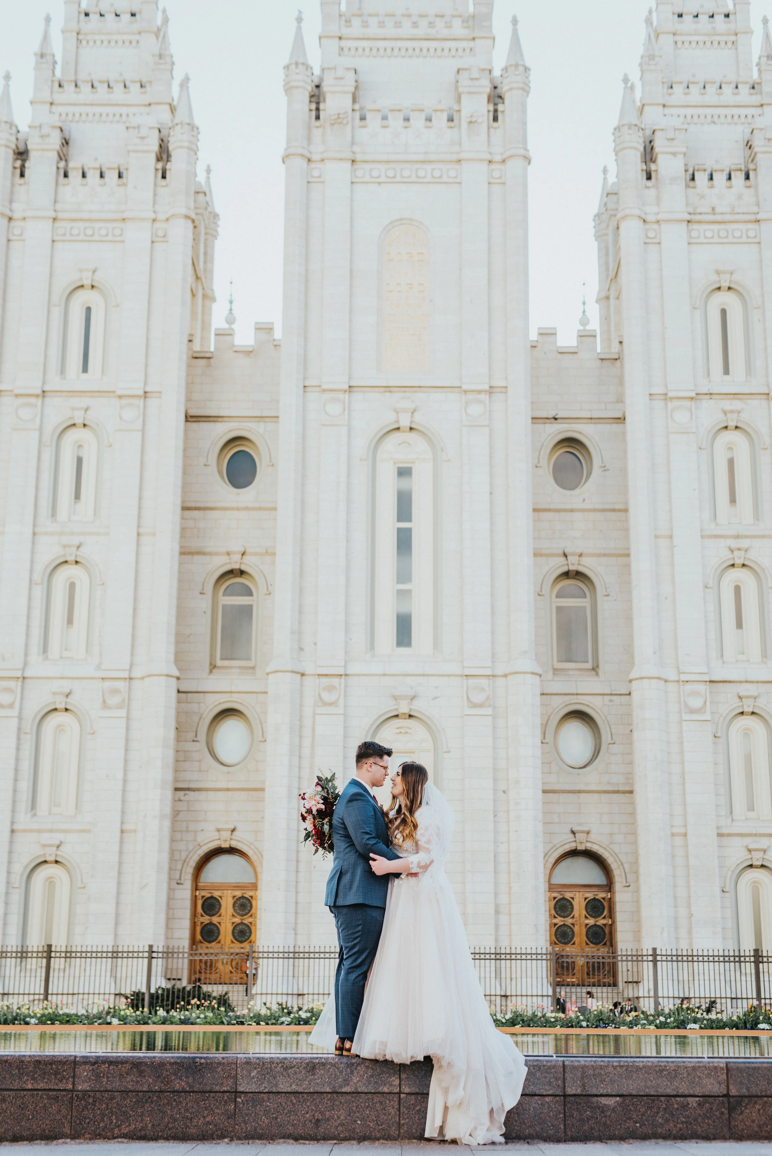  beautiful and white salt lake city temple temple marriage gorgeous couple pose inspiration mormon temple lds couple lds temple sealed for time and all eternity formal photo shoot session utah #ldswedding #mormon #utah #saltlakecity #formalwedding #w