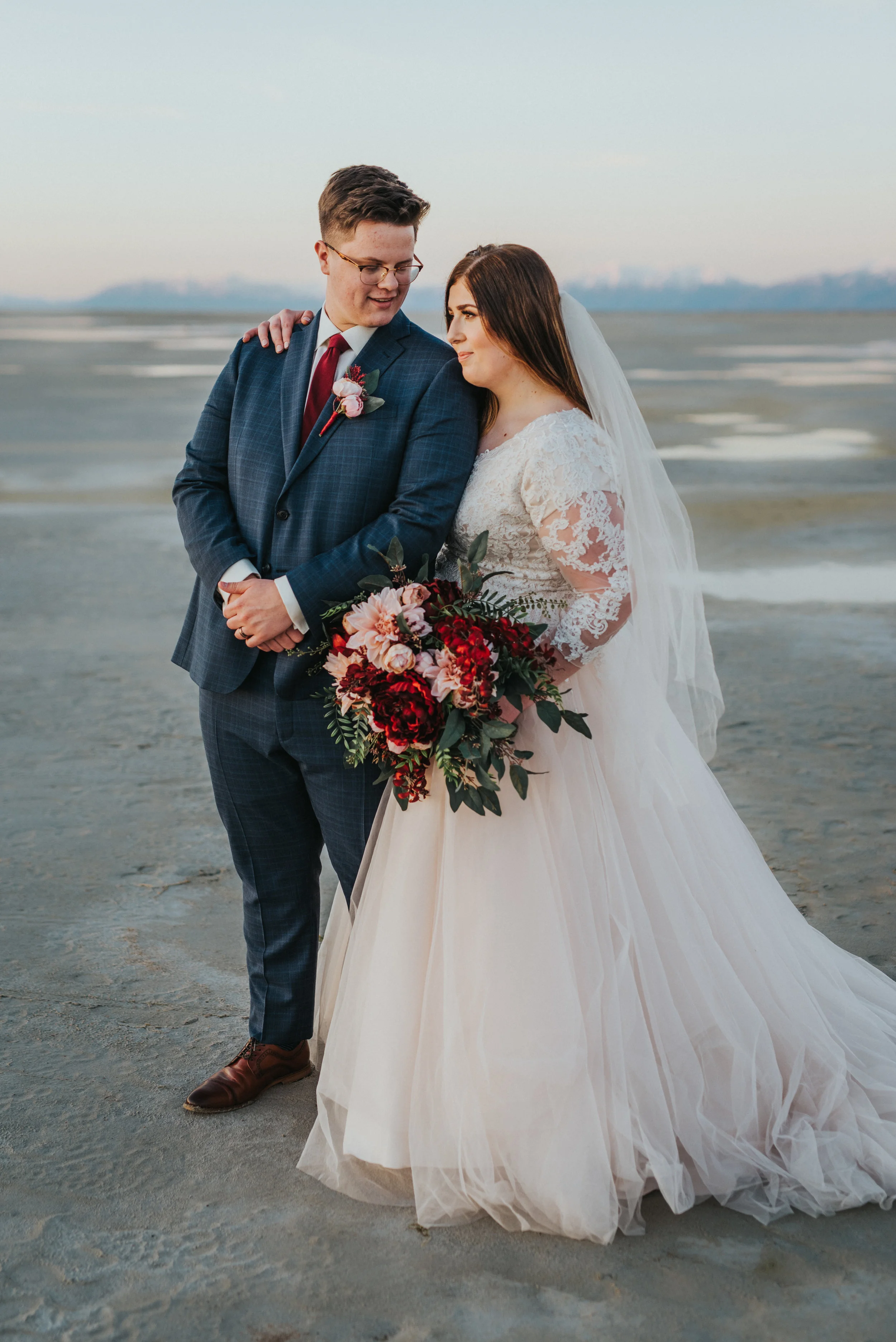  husband and wife walking through the salt flats together salt lake city outdoor photo shoot location inspiration ideas and goals beautiful lighting for a beautiful couple love is in the air love #ldswedding #mormon #utah #saltlakecity #formalwedding