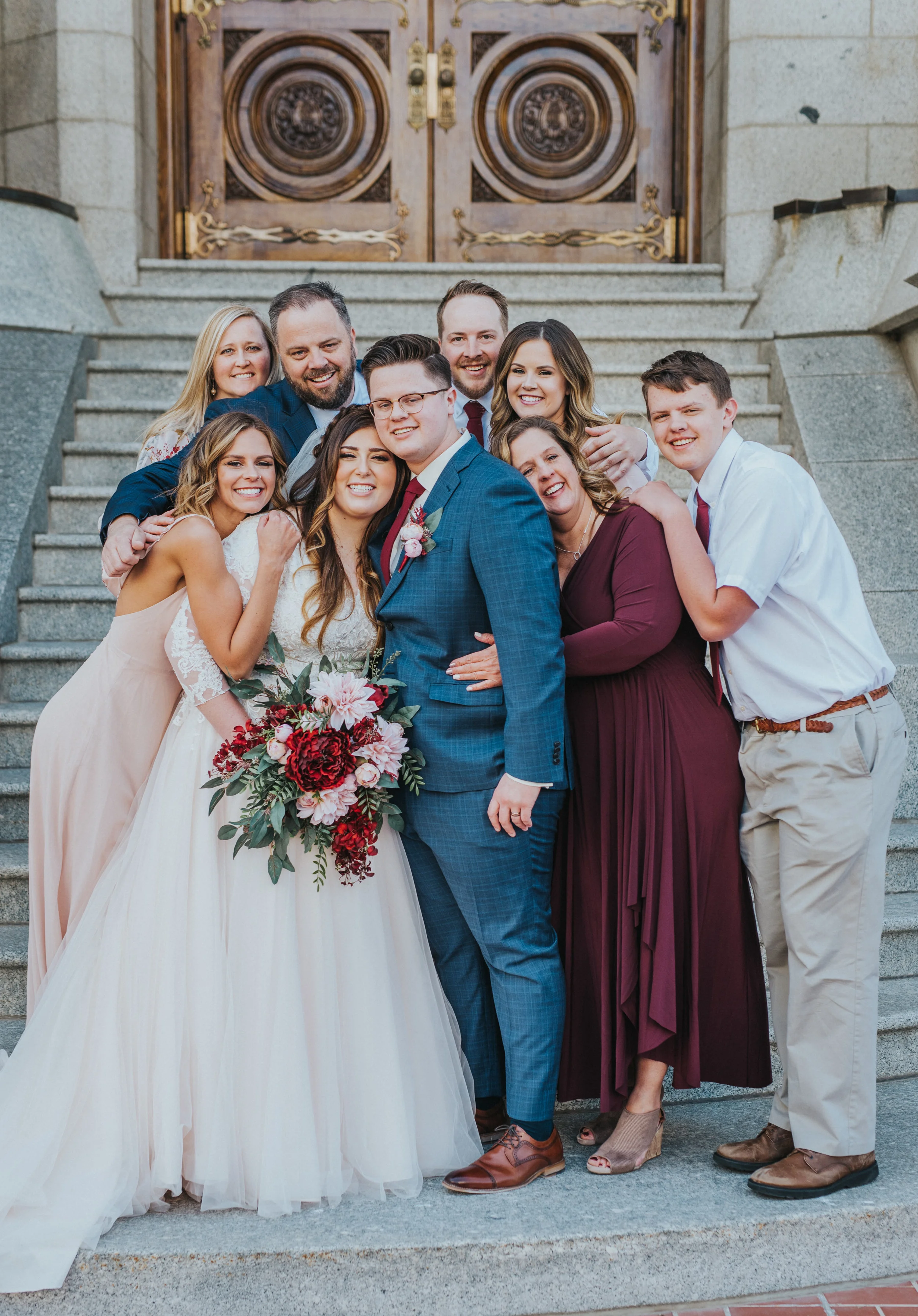  salt lake wedding photographer utah wedding photographer wedding party wedding color inspo bride and groom ball gown suit and tie siblings of the bride and groom group posing ideas salt lake temple may wedding wedding attire inspiration bridesmaids 