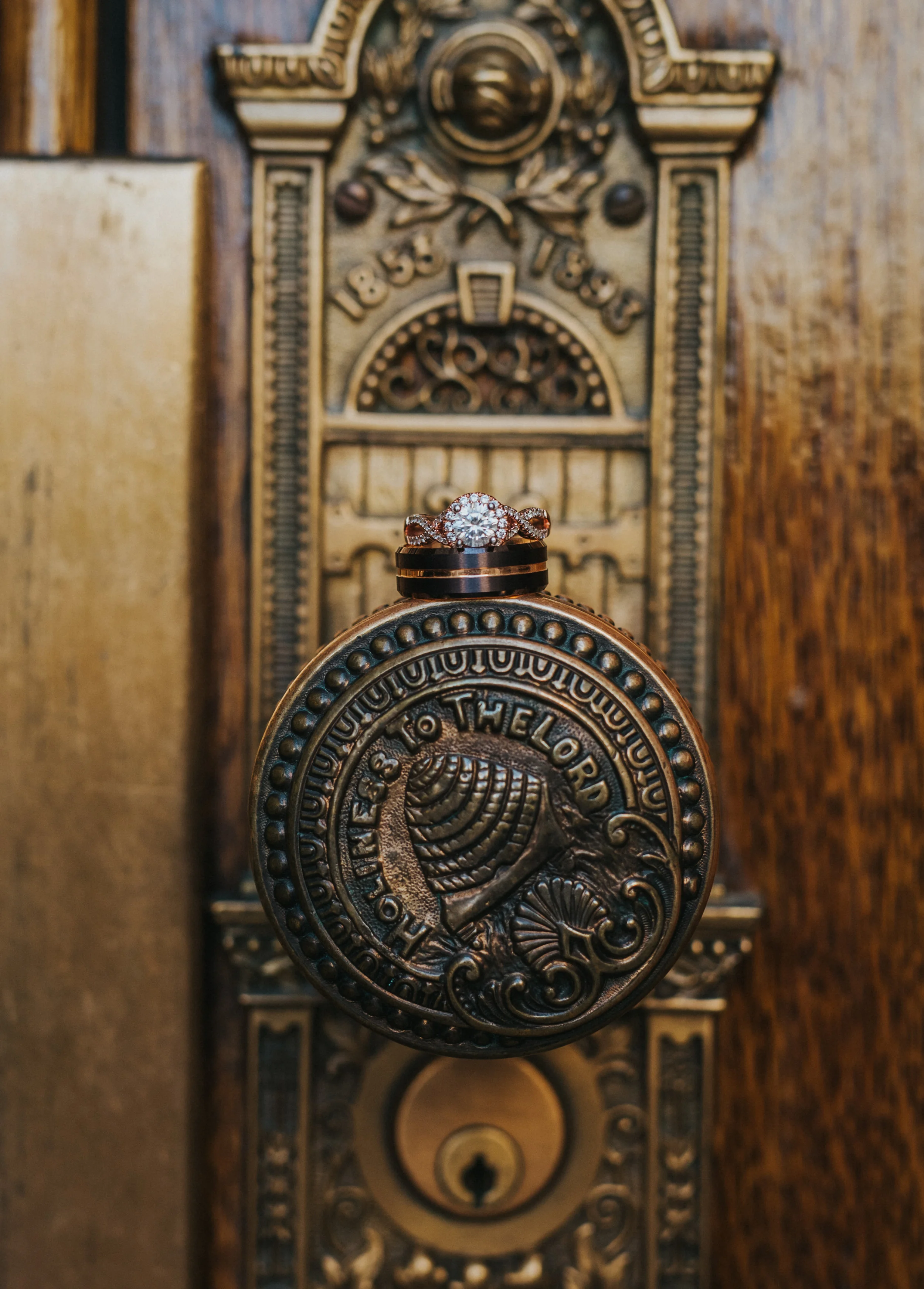  salt lake wedding photographer salt lake temple temple doors beehive door handles wedding rings wedding band engagement ring diamond ring wedding ring styling inspiration utah wedding photographer unique wedding photos detailed wedding photos #saltl
