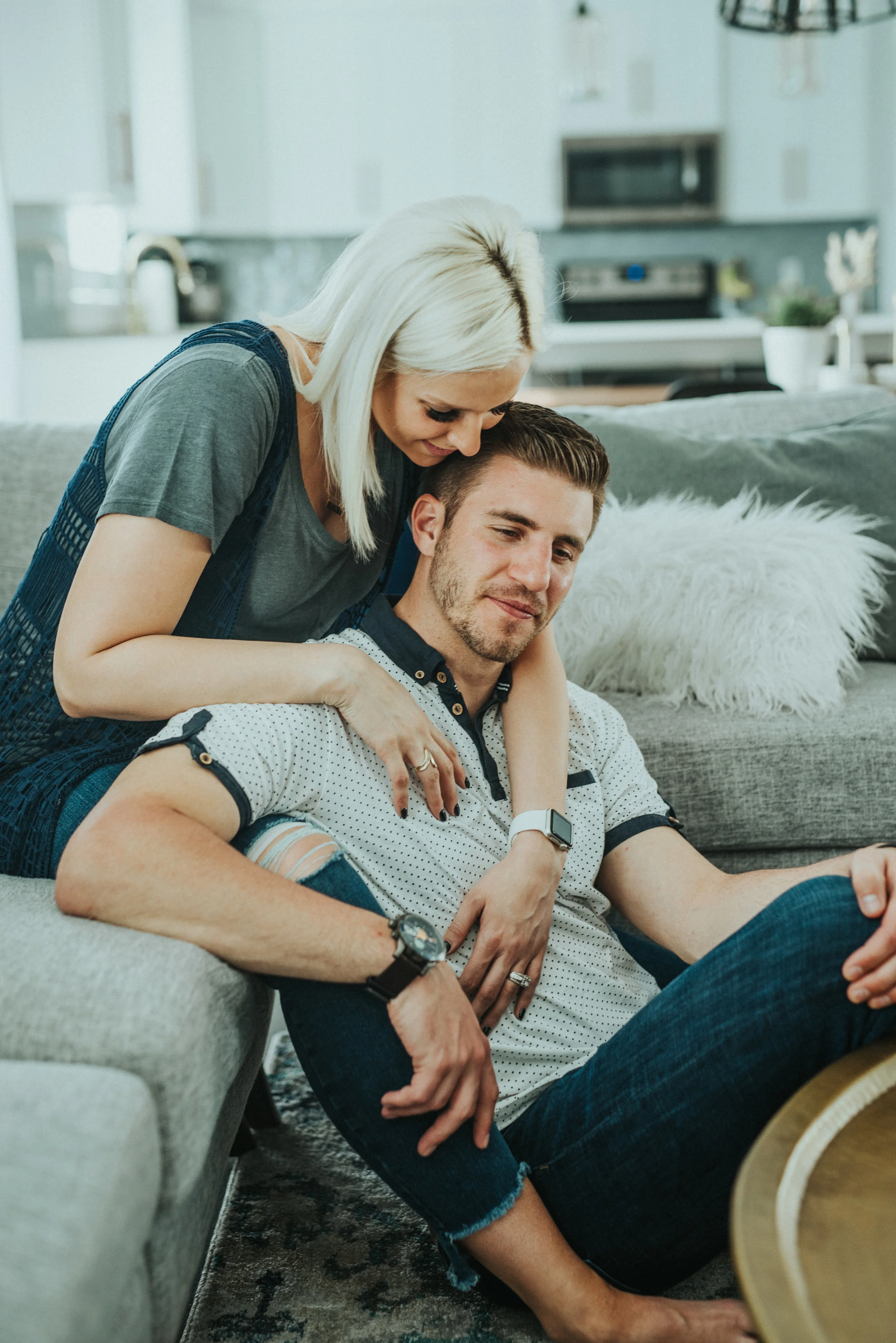  couple photoshoot in home setting cache valley photographer in home session casual outfit inspo happy couple future parents couple posing ideas couple sitting down lifestyle photography lifestyle family shoot hair and makeup inspo what to wear to co