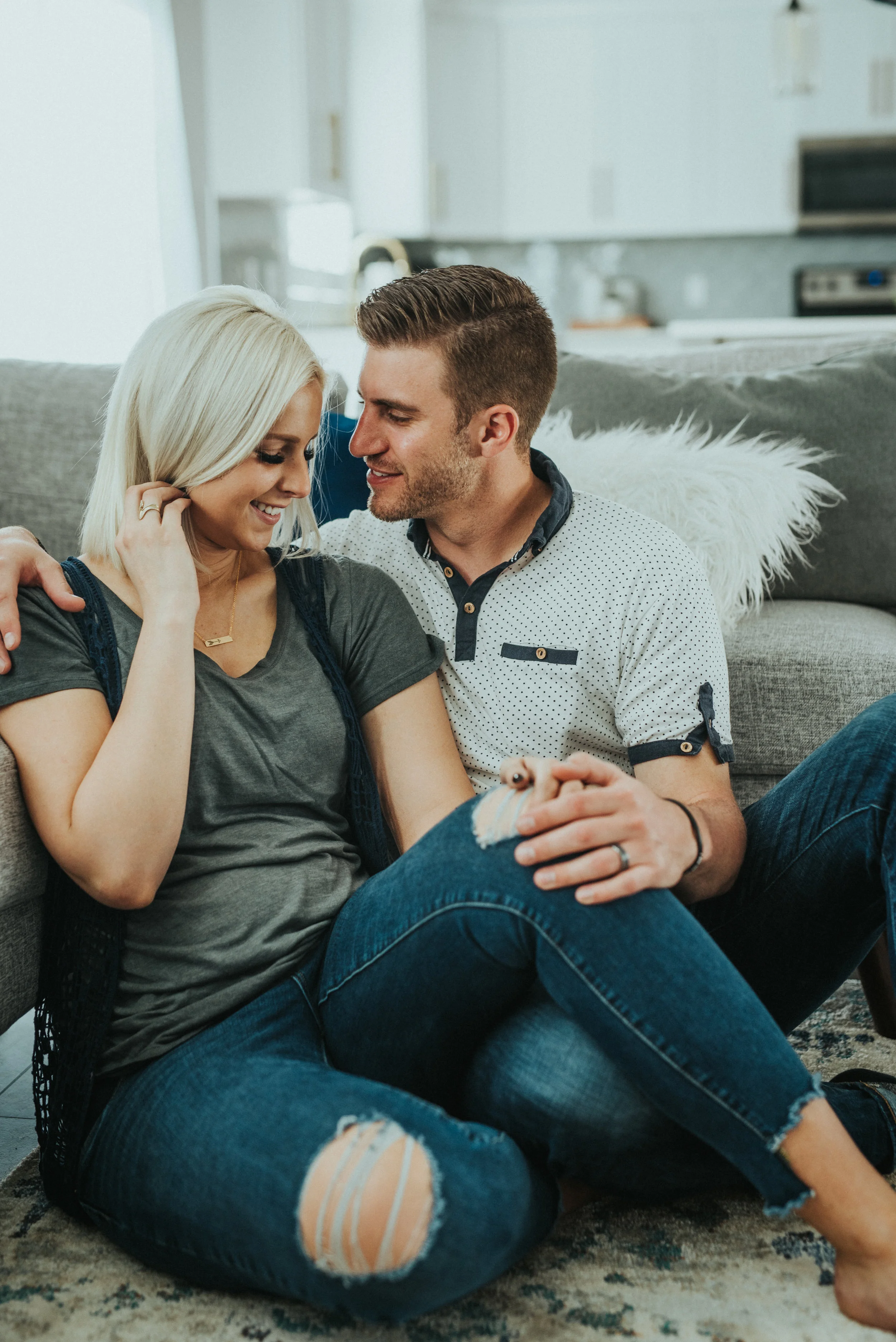  in home lifestyle photoshoot happy couple hand in hand couple posing inspiration couple sitting down casual outfit inspo casual maternity session jewelry inspo what to wear to lifestyle family photoshoot relationship goals best friends lovers future
