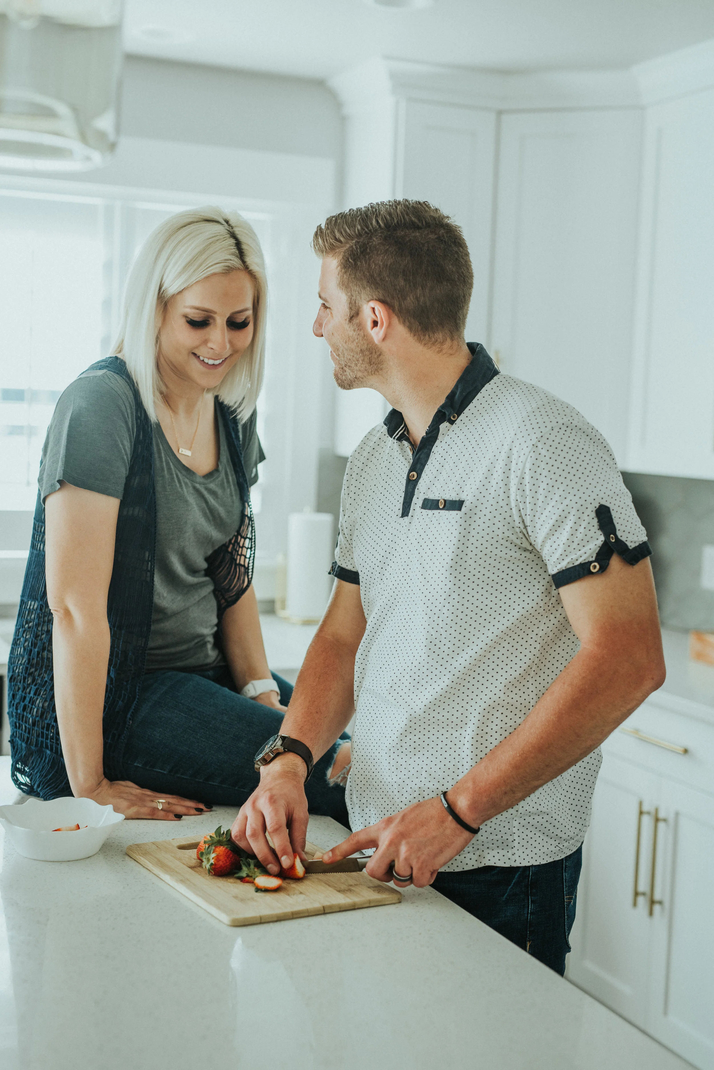  kitchen photoshoot happy couple parents to be baby girl mom to be dad to be what to wear to couples photoshoot lifestyle in home session natural light photos outfit inspiration hair and make up ideas casual outfit inspo #loganutah #cachevalleyfamily