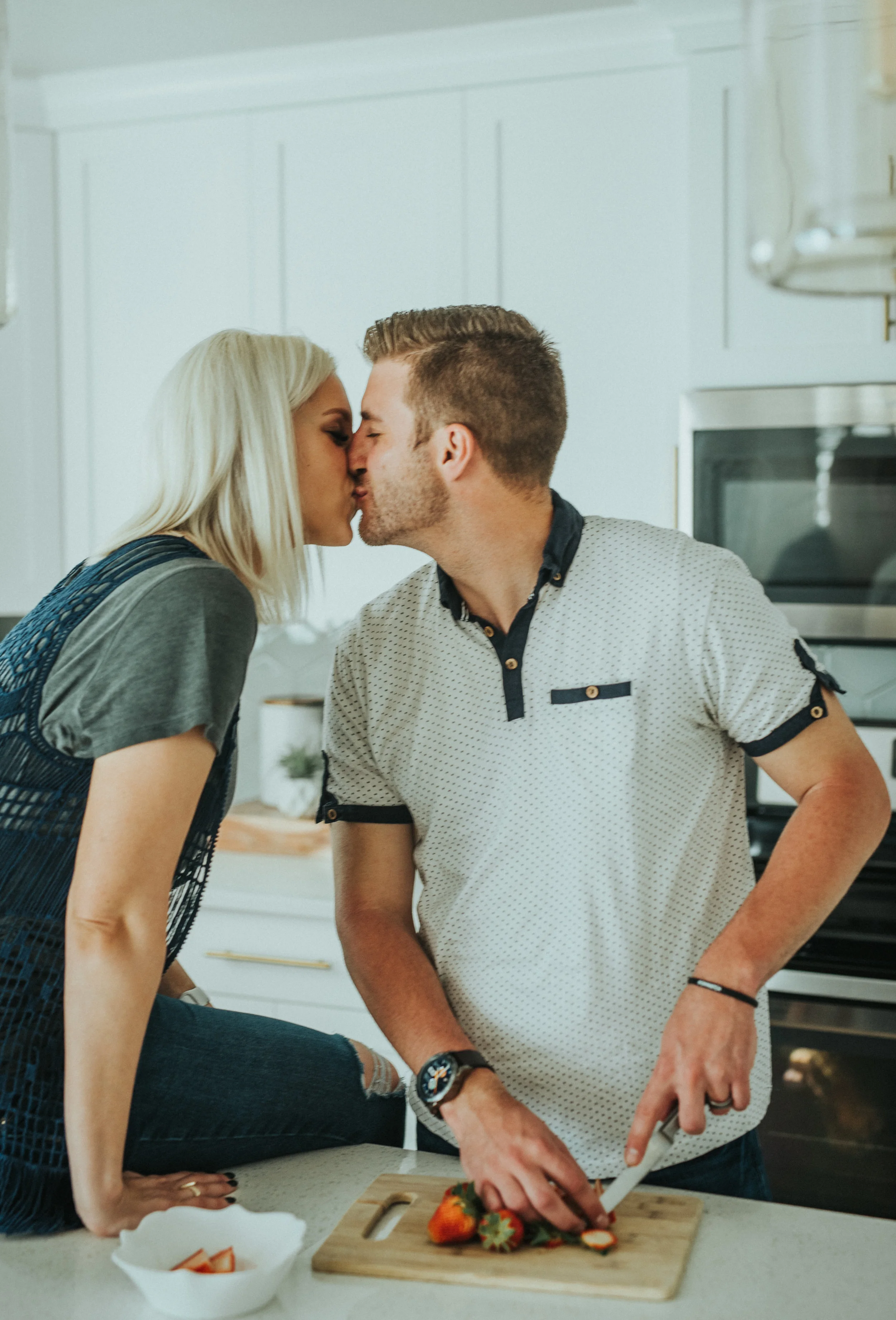  couple posing inspiration kissing photos girl sitting down intimate lovers best friends husband and wife parents to be in home photoshoot romantic lifestyle photography kitchen photoshoot in home lifestyle pictures casual photoshoot #loganutah #cach
