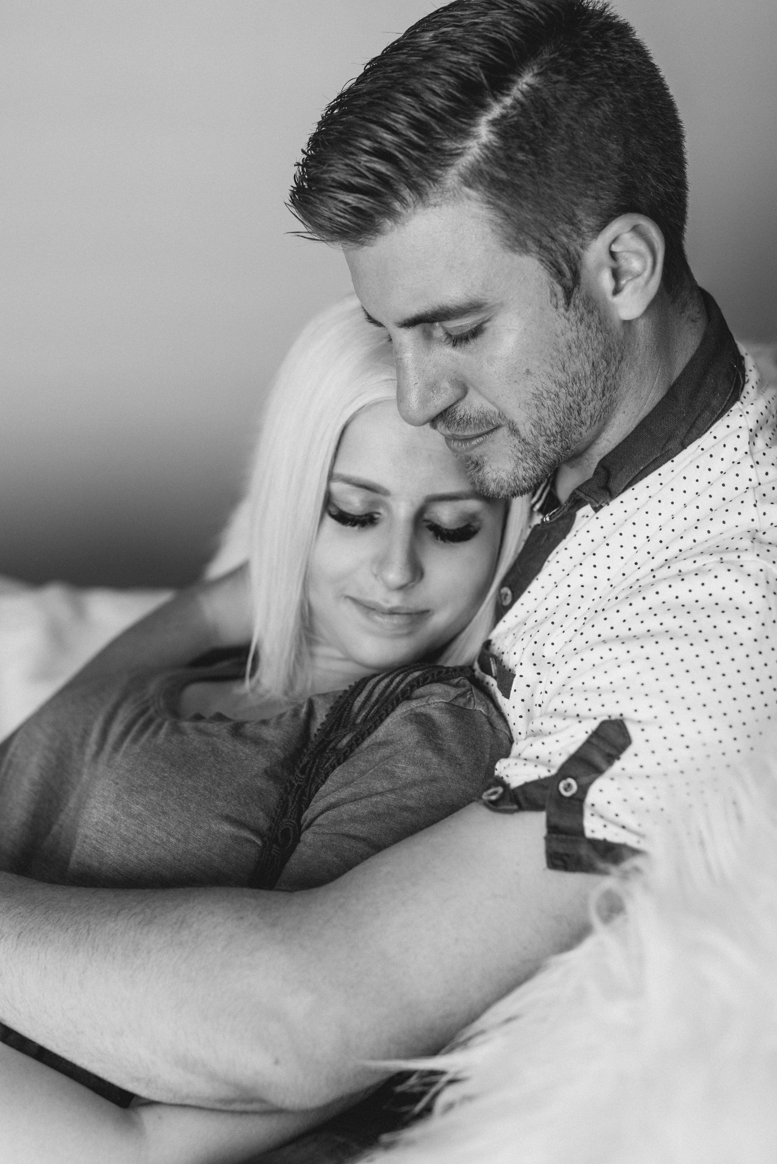  intimate lovers relationship goals cache valley photographer black and white photos couple photoshoot in home photo session lifestyle couples shoot couple posing inspiration girl laying into boy boys arms around girl romantic posing ideas eyes close